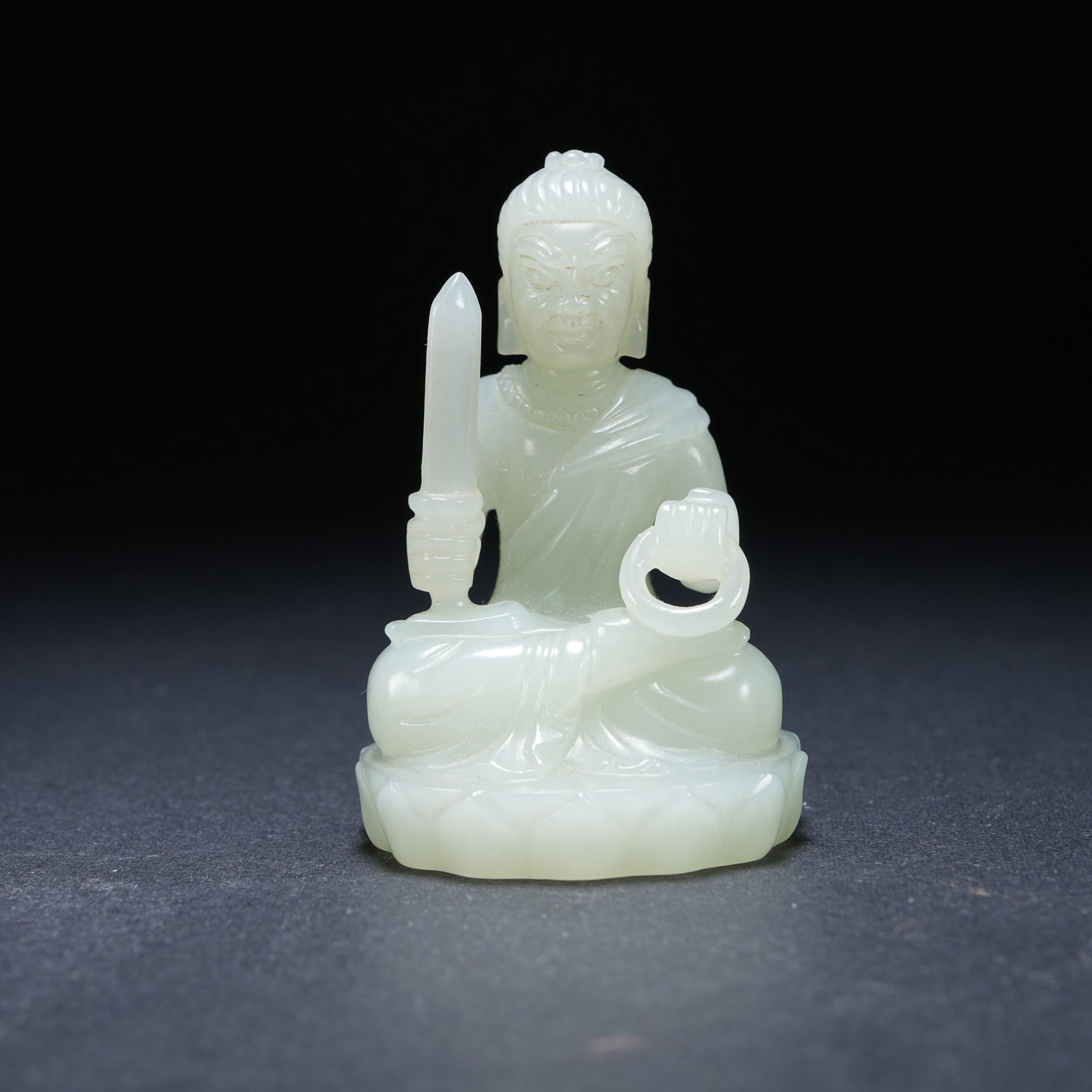 A HOTAN WHITE JADE SEATED STATUE OF ACALA (1 of 8)