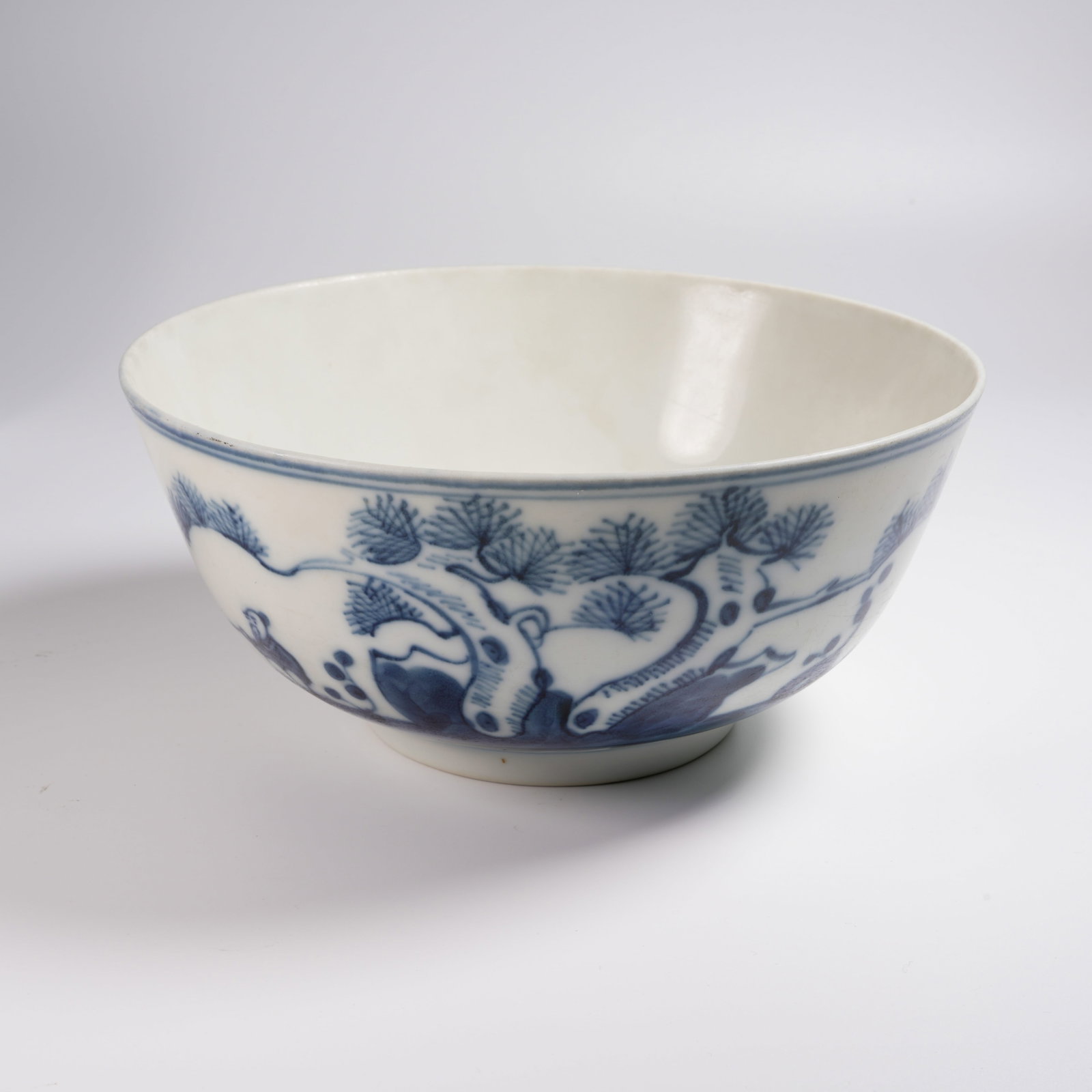 A BLUE-AND-WHITE LARGE BOWL WITH "OLD MAN FISHING BENEATH PINE TREES" SCENE (1 of 9)