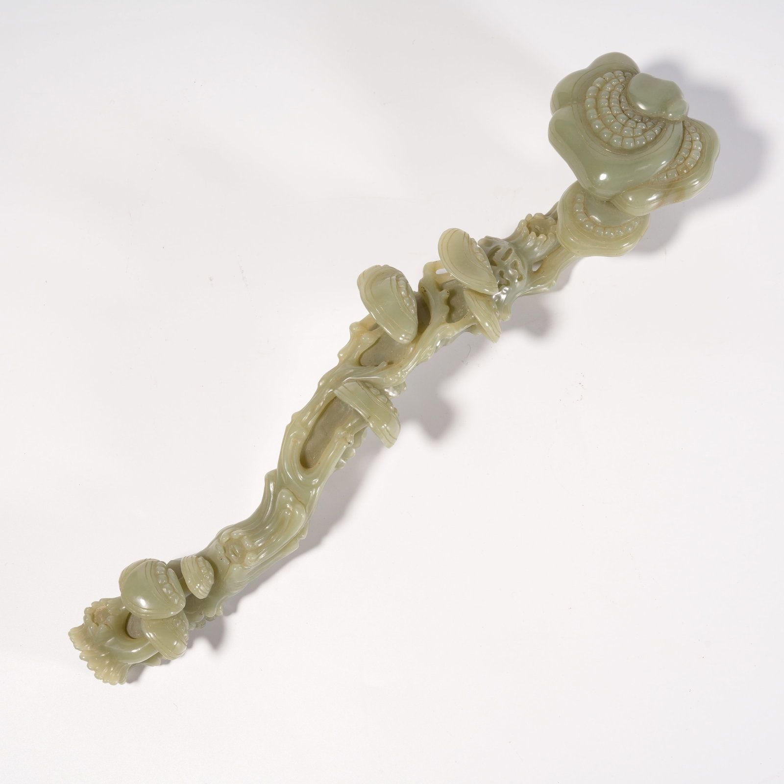 A HETIAN JADE RUYI CARVED IN LINGZHI SHAPE (1 of 7)