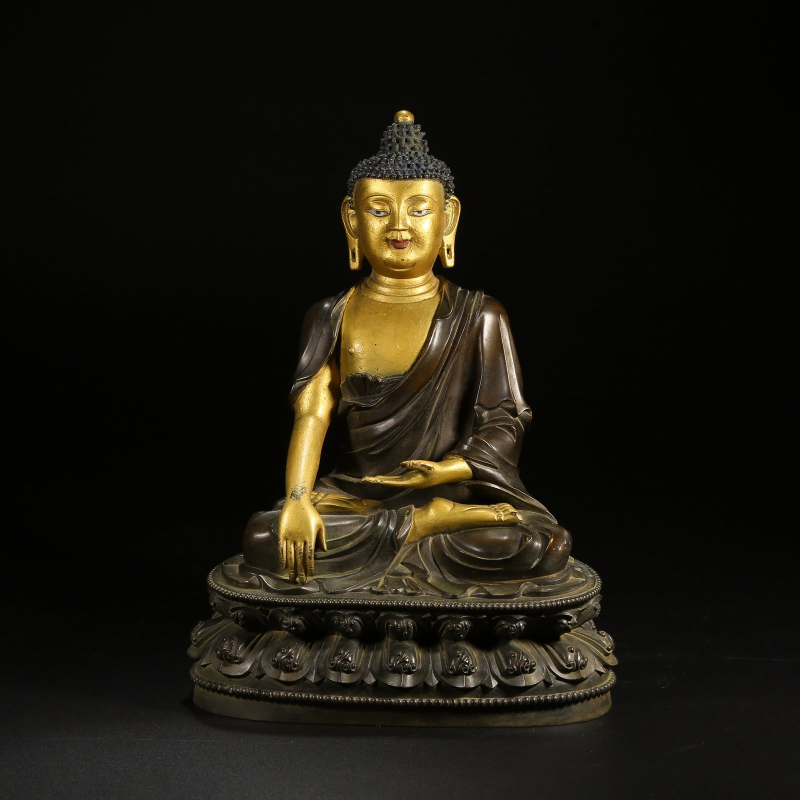 A BRONZE SHAKYAMUNI STATUE WITH PARTIAL GILT DECORATION (1 of 8)