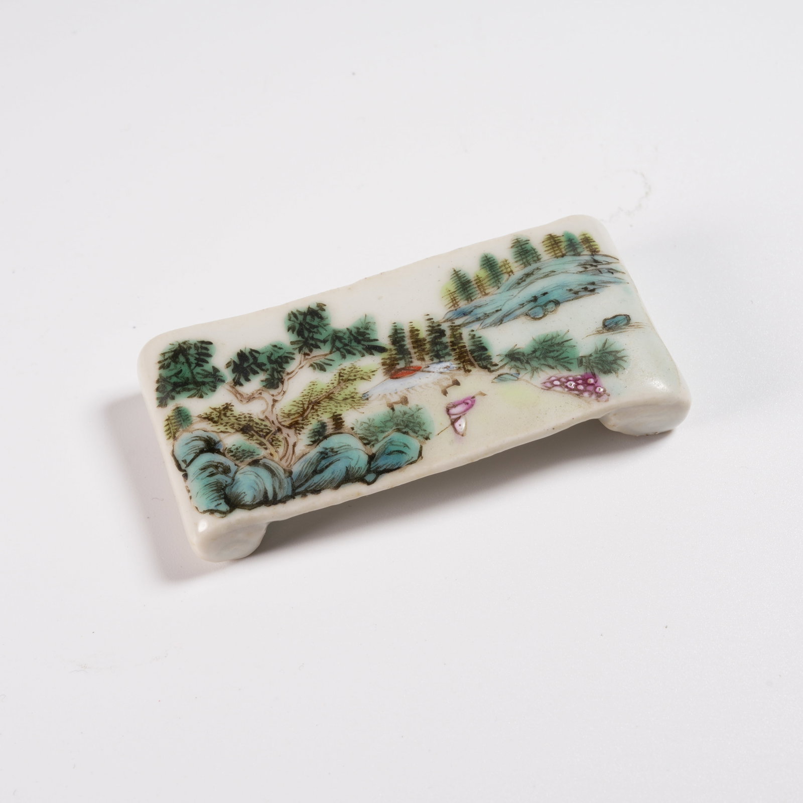 A FAMILLE ROSE LANDSCAPE-DECORATED INK REST (1 of 8)
