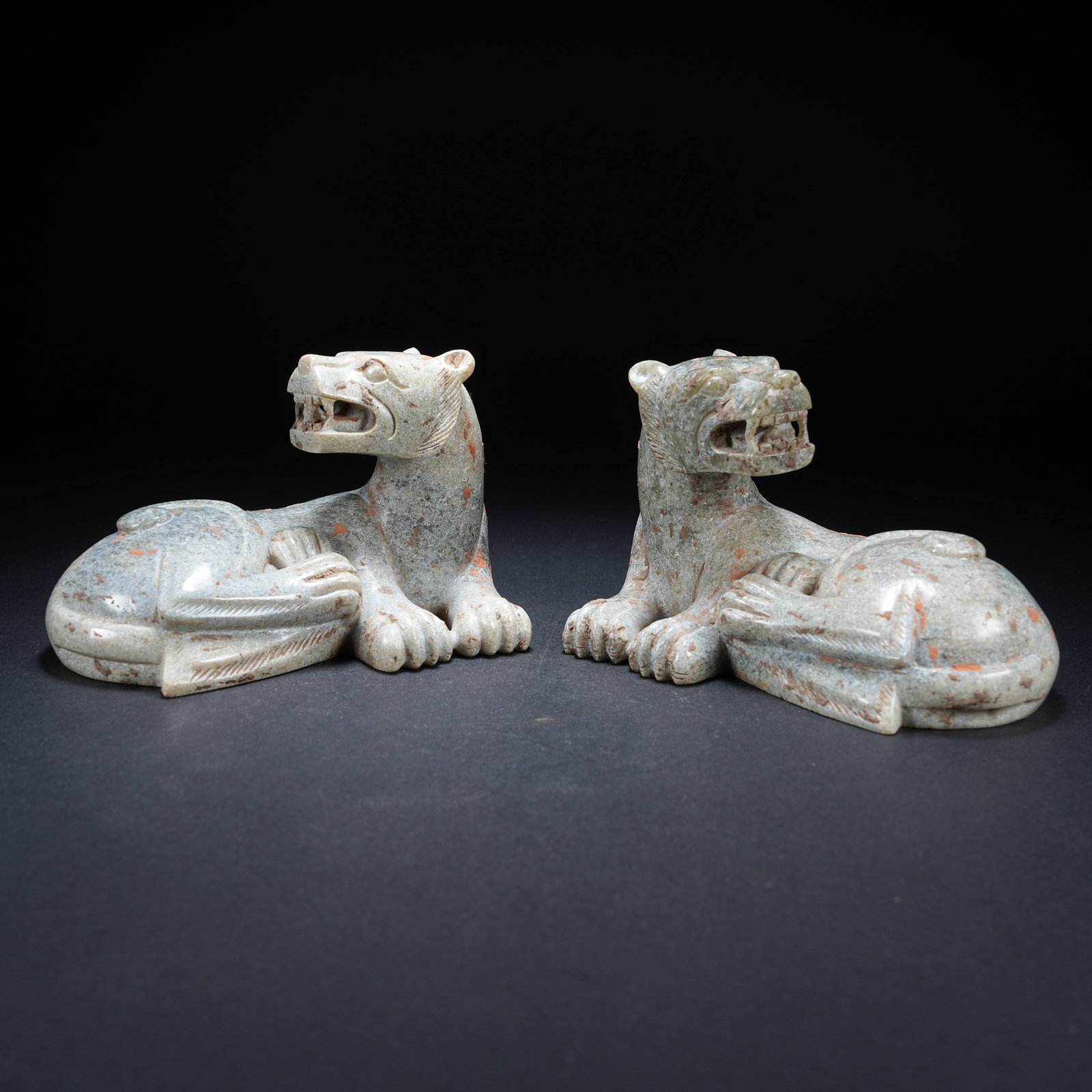 A SET OF ARCHAIC JADE RECLINING BEASTS (1 of 9)