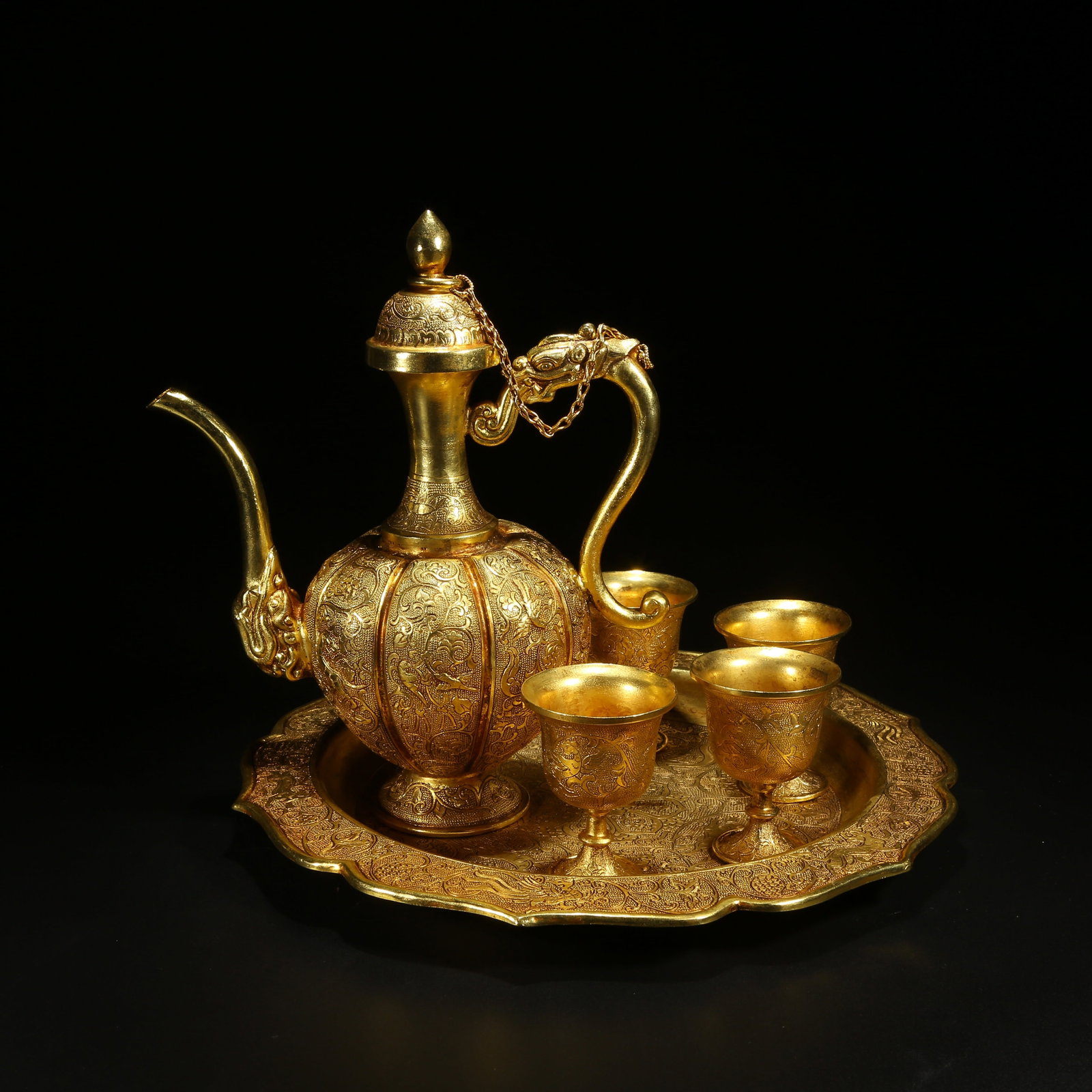 A GILDED BRONZE WINE SET WITH FLORAL AND BIRD PATTERN: Gilded Bronze Wine Set with Floral and Bird Pattern