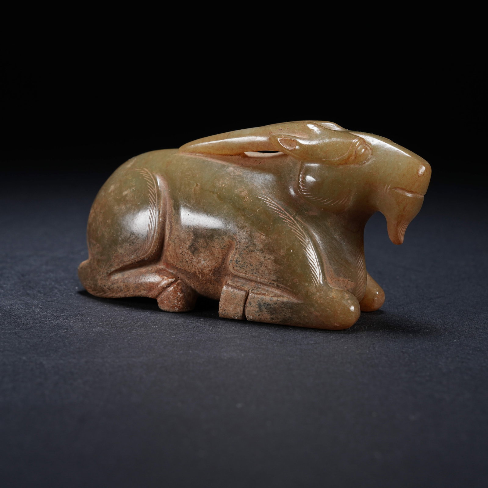 A ARCHAIC JADE RECLINING GOAT ORNAMENT (1 of 8)
