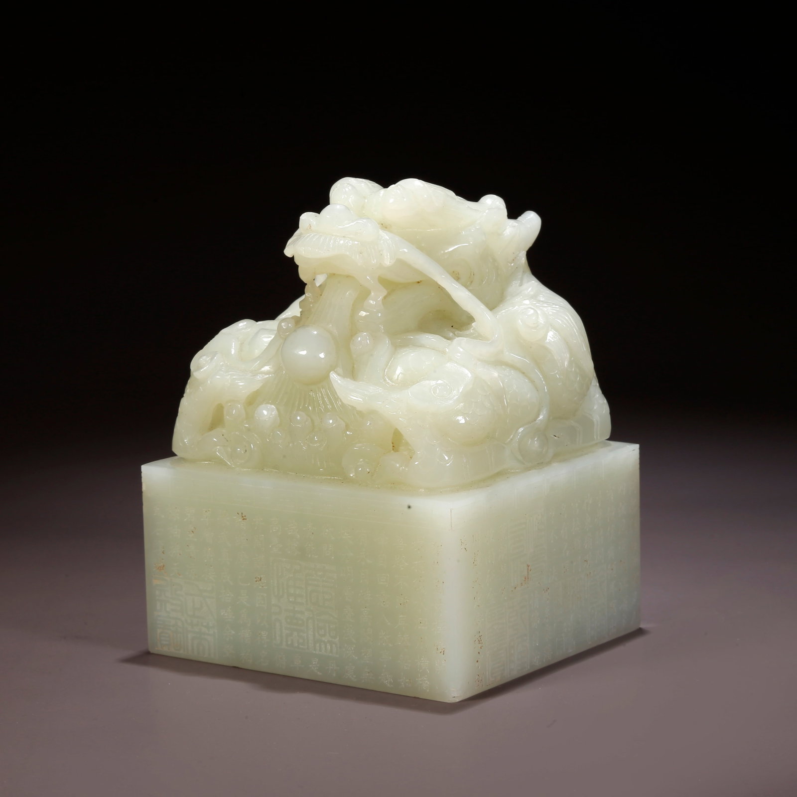 A HETIAN JADE DRAGON-HANDLE SEAL (1 of 10)
