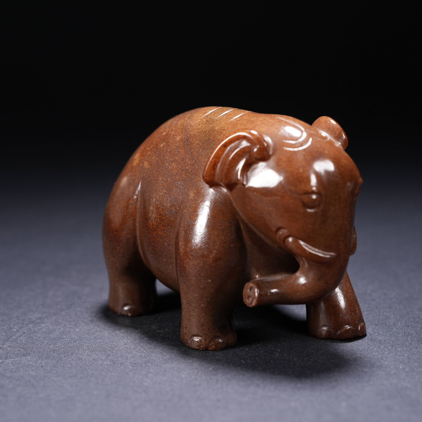 A ARCHAIC JADE "PEACE THROUGH ELEPHANTS" FIGURINE (1 of 8)