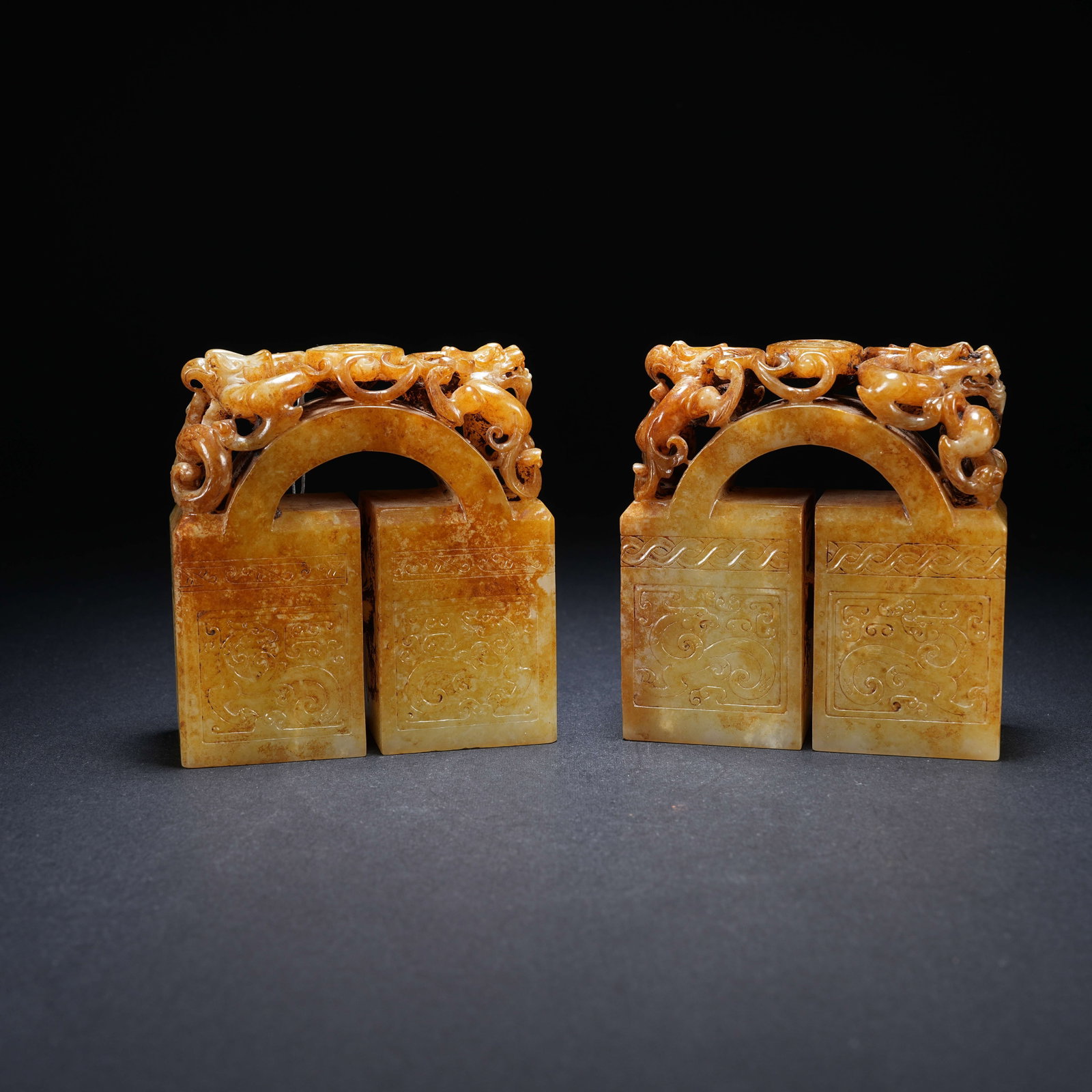 A SET OF ARCHAIC JADE ARCH-SHAPED COMBINED DRAGON AND PHOENIX SEALS (1 of 9)