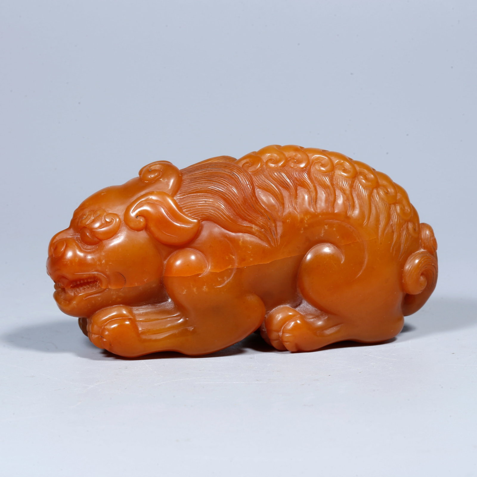 A SHOUSHAN TIANHUANG STONE ORNAMENT CARVED IN THE FORM OF A LION (1 of 9)