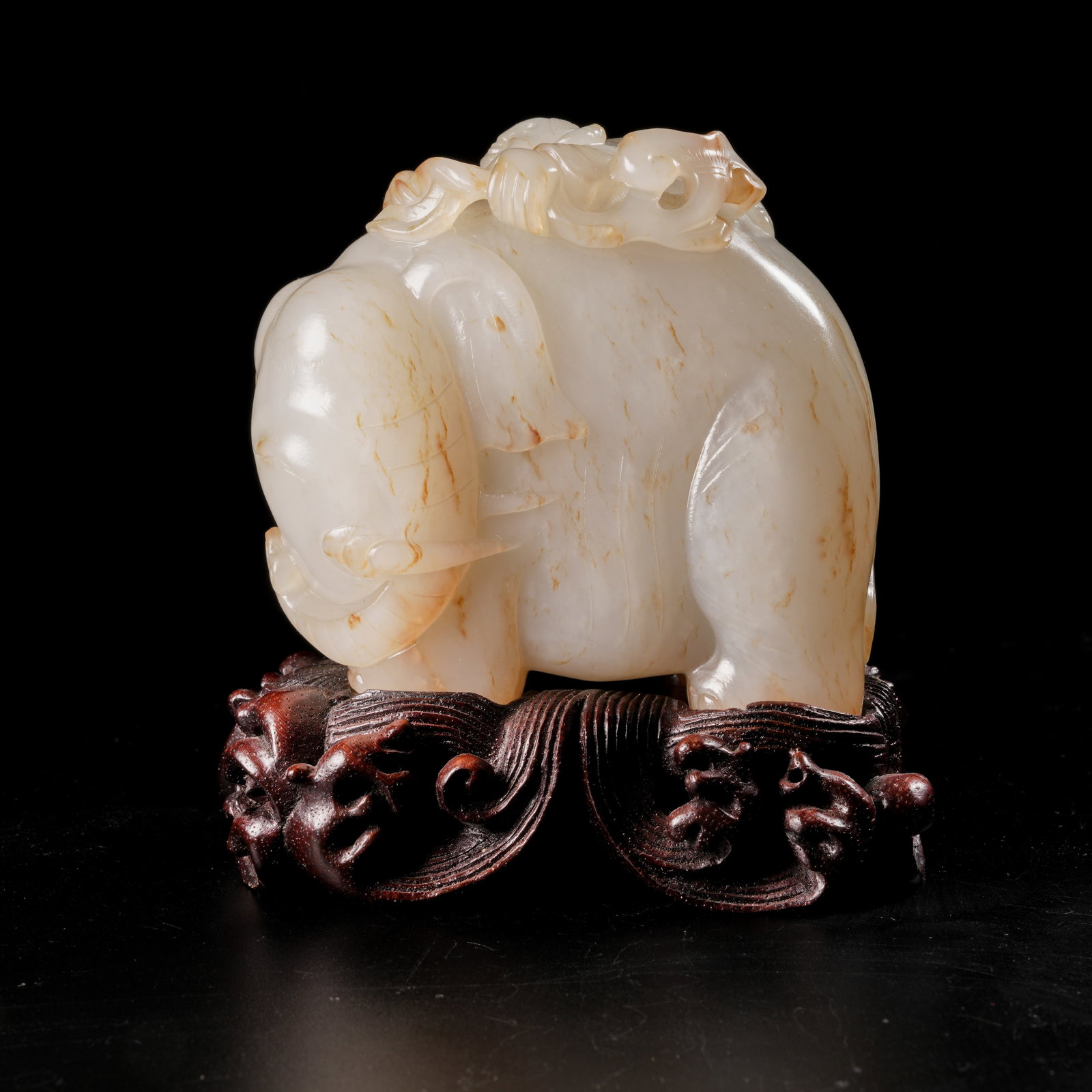 A HETIAN JADE "ELEPHANT BRINGS PEACE" ORNAMENT: Hetian Jade "Elephant Brings Peace" Ornament