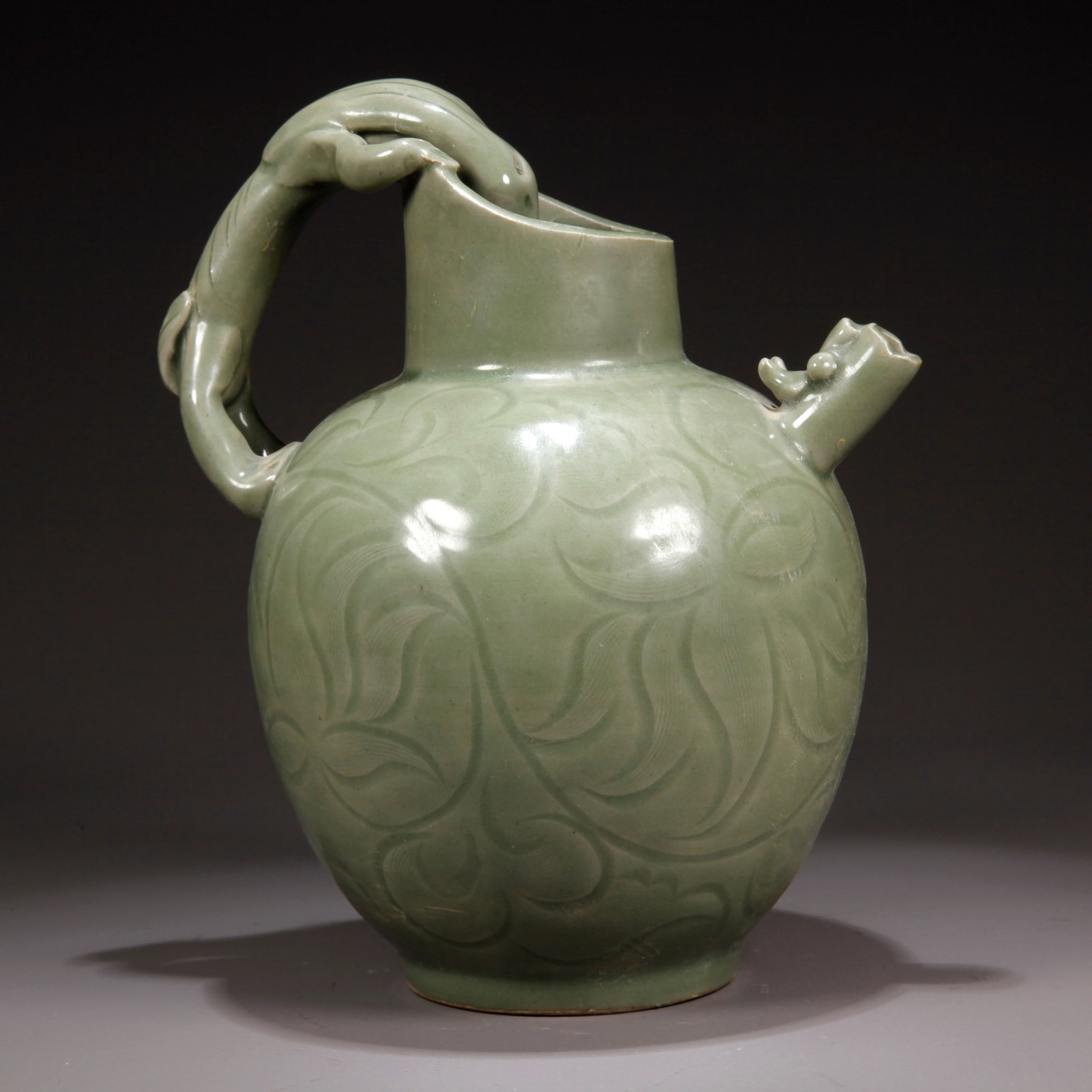 A YAOZHOU KILN FLORAL PATTERN TEAPOT: Yaozhou Kiln Floral Pattern Teapot