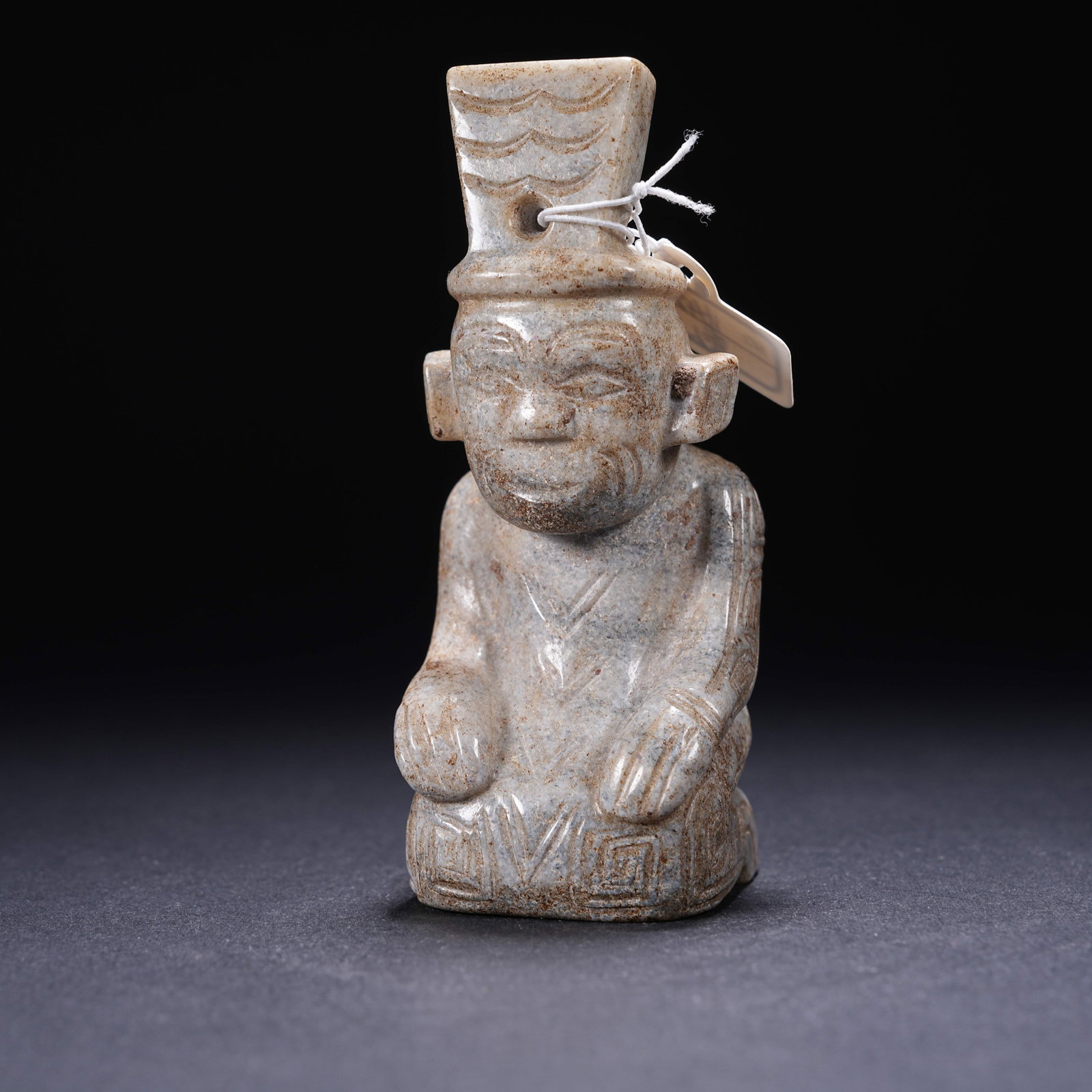 A ARCHAIC JADE KNEELING FIGURE (1 of 8)