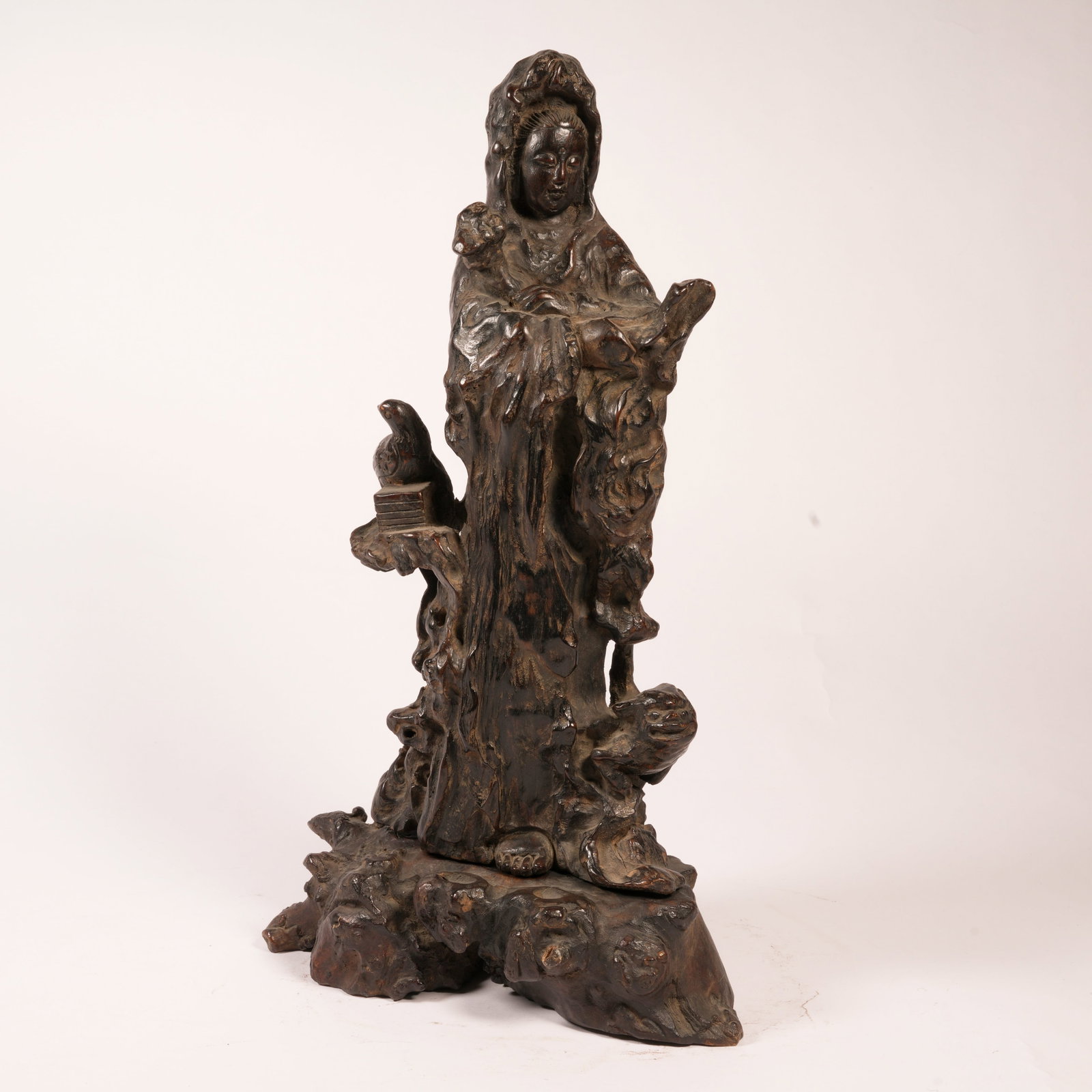 A ZITAN STANDING FIGURE OF GUANYIN HOLDING A SCROLL (1 of 9)