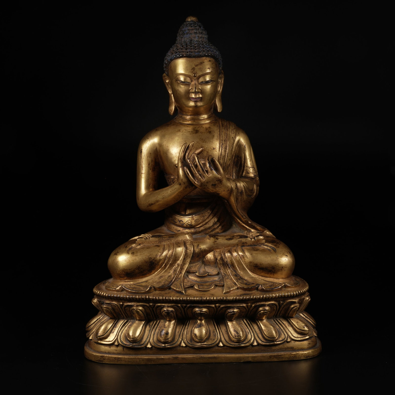 A GILT-BRONZE SHAKYAMUNI PREACHING STATUE: Gilt-Bronze Shakyamuni Preaching Statue