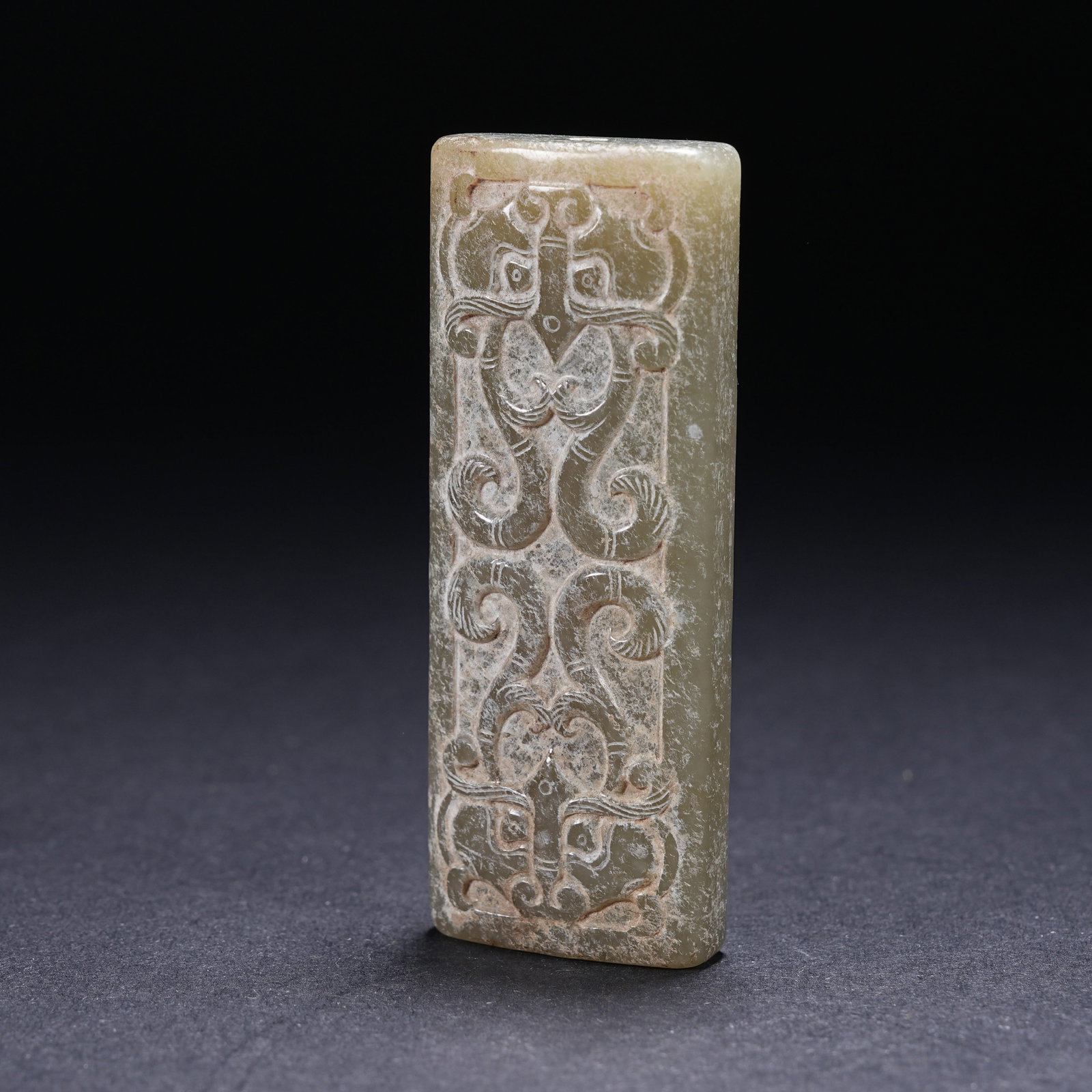 A ARCHAIC JADE BEAD WITH BEAST-MASK MOTIF (1 of 9)