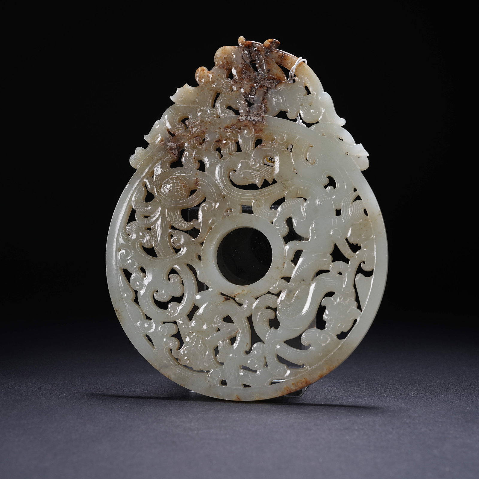 A ARCHAIC JADE BI DISC WITH CHILONG (HORNLESS DRAGON) AND PROJECTING EDGES: Archaic Jade Bi Disc with Chilong (Hornless Dragon) and Projecting Edges