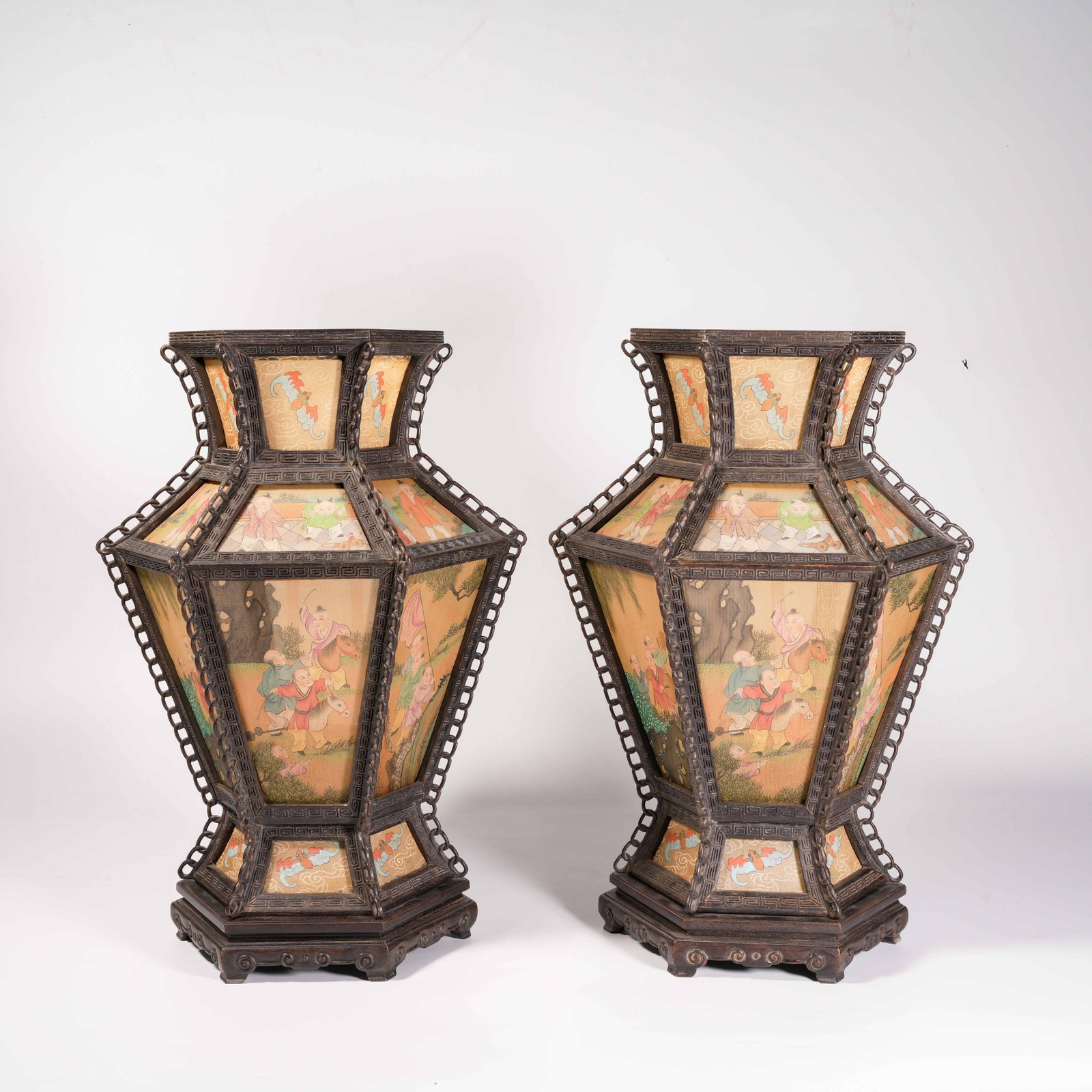 A SET OF PALACE LANTERNS WITH HAND-PAINTED INFANTS AT PLAY ON ZITAN WOOD AND SILK (1 of 10)