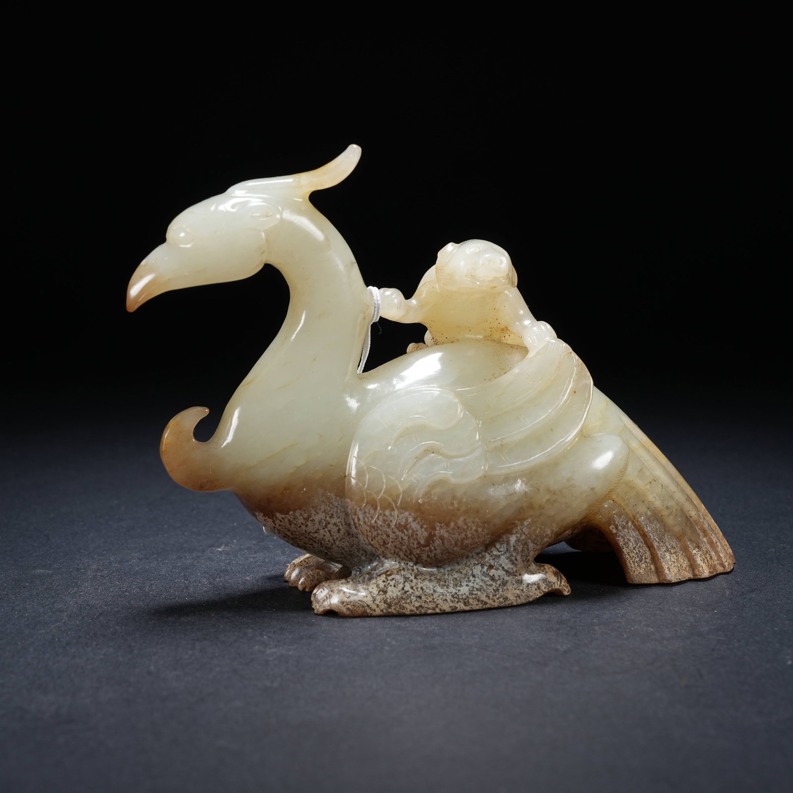 A ARCHAIC JADE HERO ORNAMENT (1 of 8)