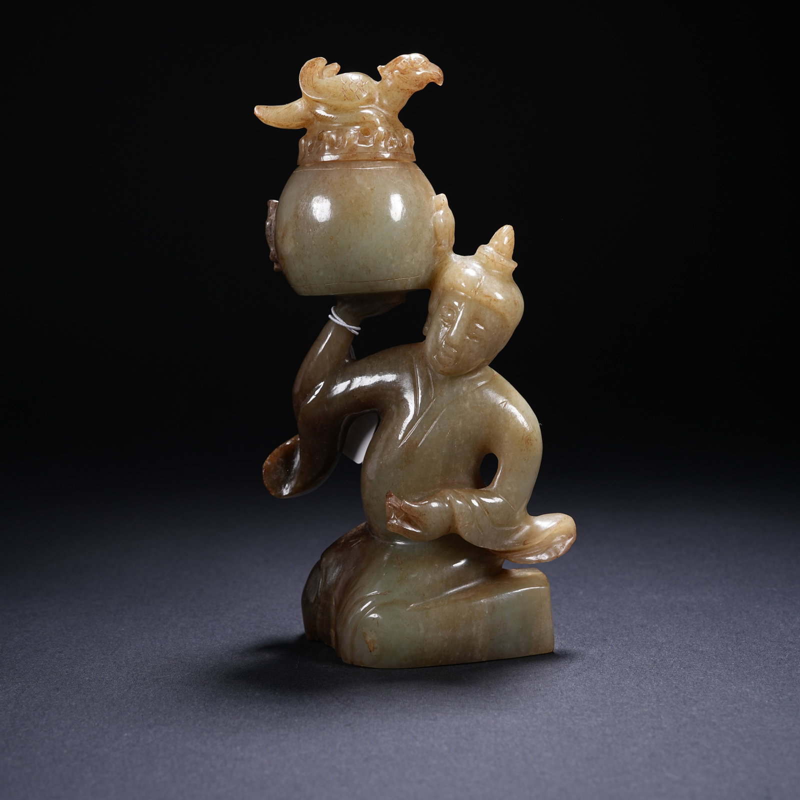 A ARCHAIC JADE INCENSE BURNER WITH KNEELING FIGURE SUPPORTING A PHOENIX (1 of 8)