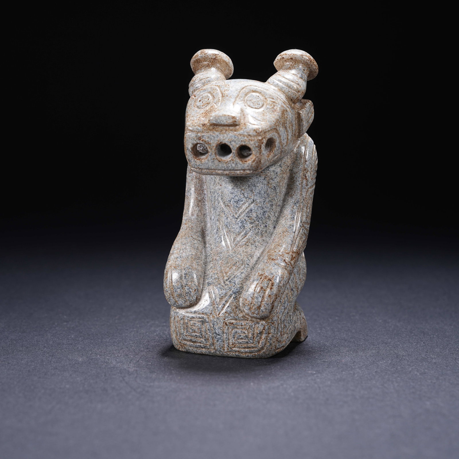 A ARCHAIC JADE KNEELING FIGURE WITH THREE NOSTRIL OPENINGS (1 of 9)