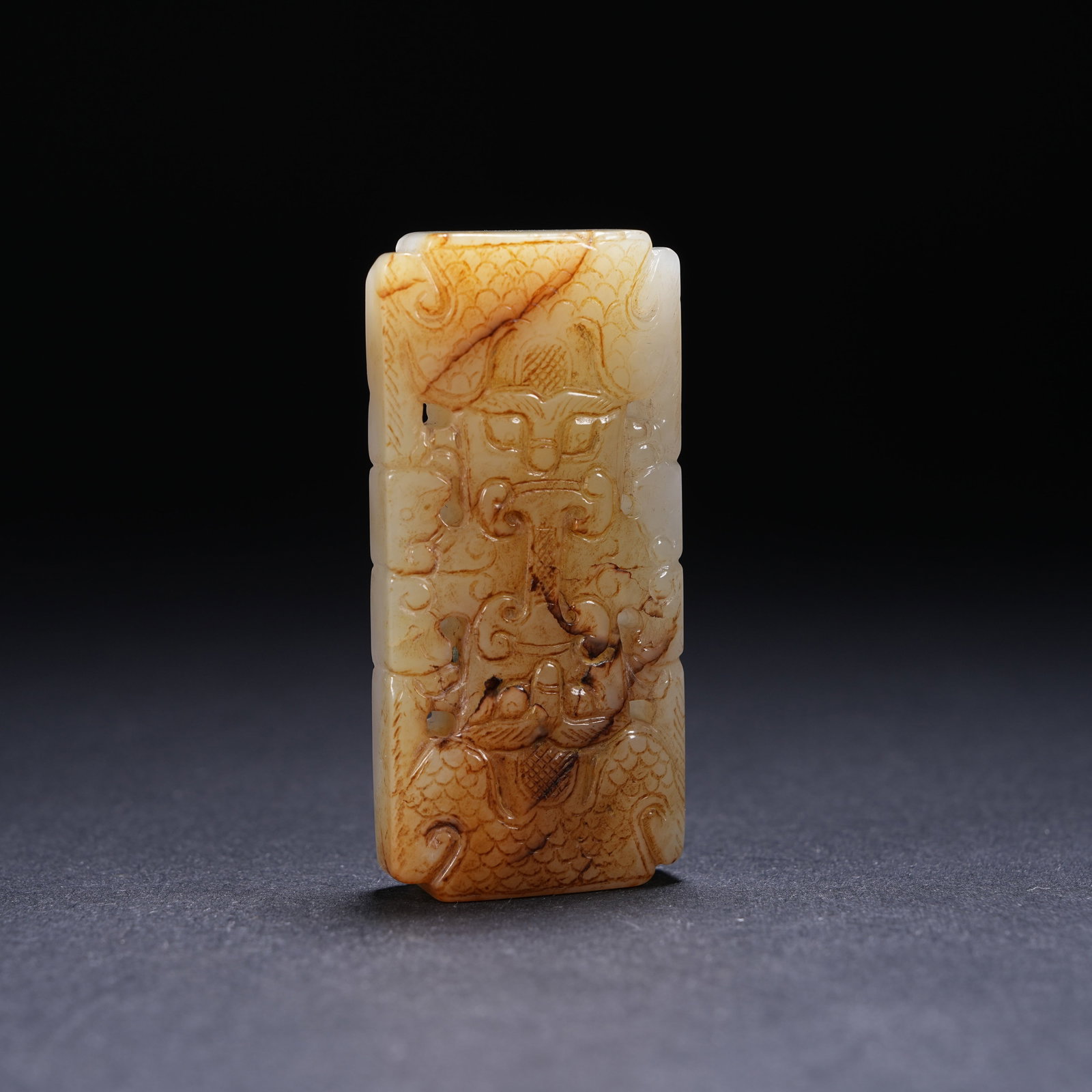 A ARCHAIC JADE OPENWORK BEAD WITH BEAST-MASK MOTIF (1 of 9)