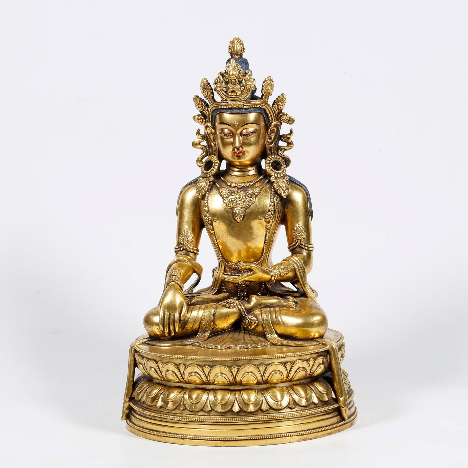 A GILT-BRONZE BUDDHA STATUE (1 of 9)