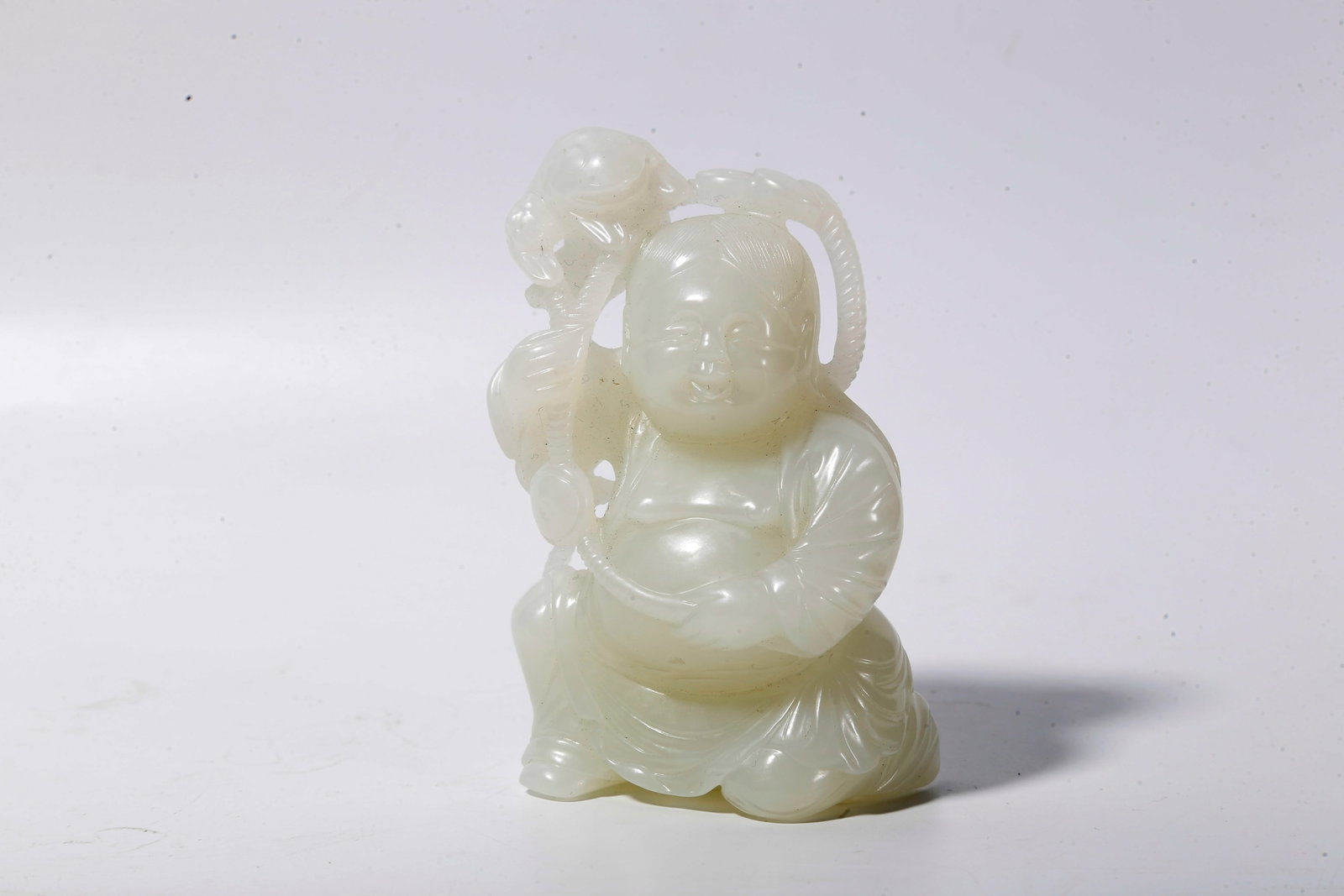 A NEPHRITE CARVING LIU HAI PLAYING WITH GOLDEN TOAD ORNAMENT (1 of 9)