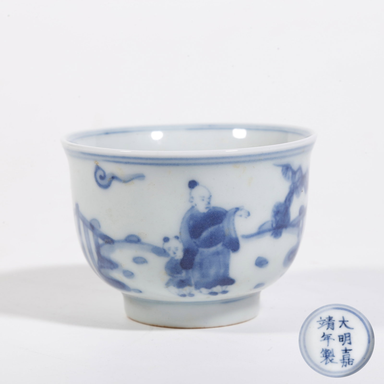 A BLUE AND WHITE CUP WITH FIGURE STORY PATTERN: Blue and White Cup with Figure Story Pattern