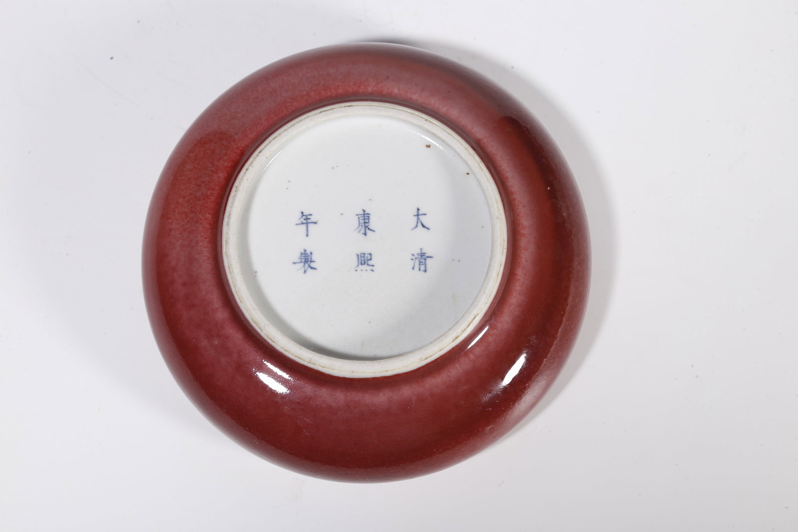 A RED GLAZE WASHER - 10
