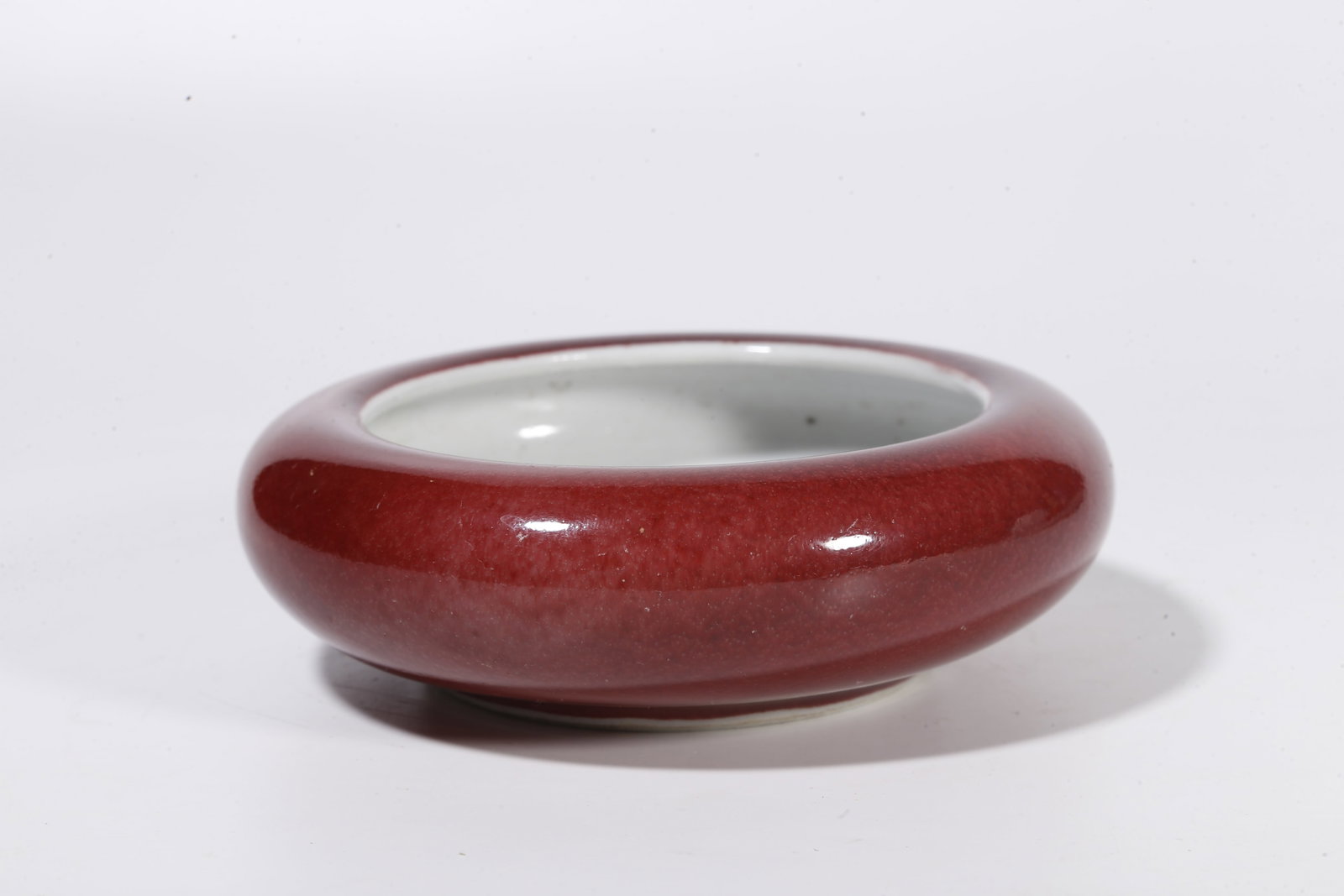 A RED GLAZE WASHER - 4