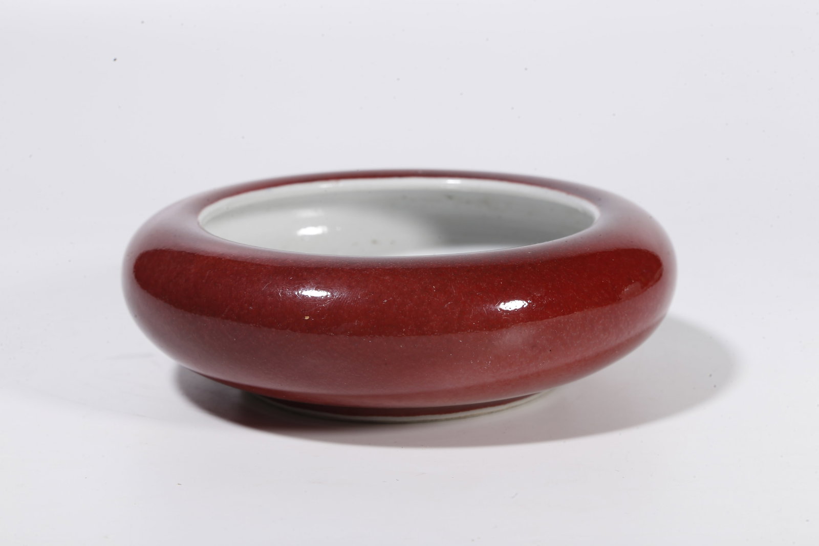 A RED GLAZE WASHER - 5