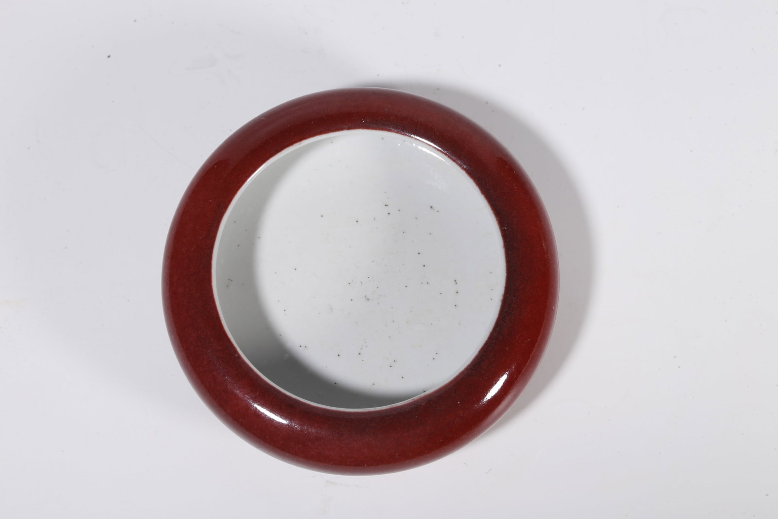 A RED GLAZE WASHER - 7
