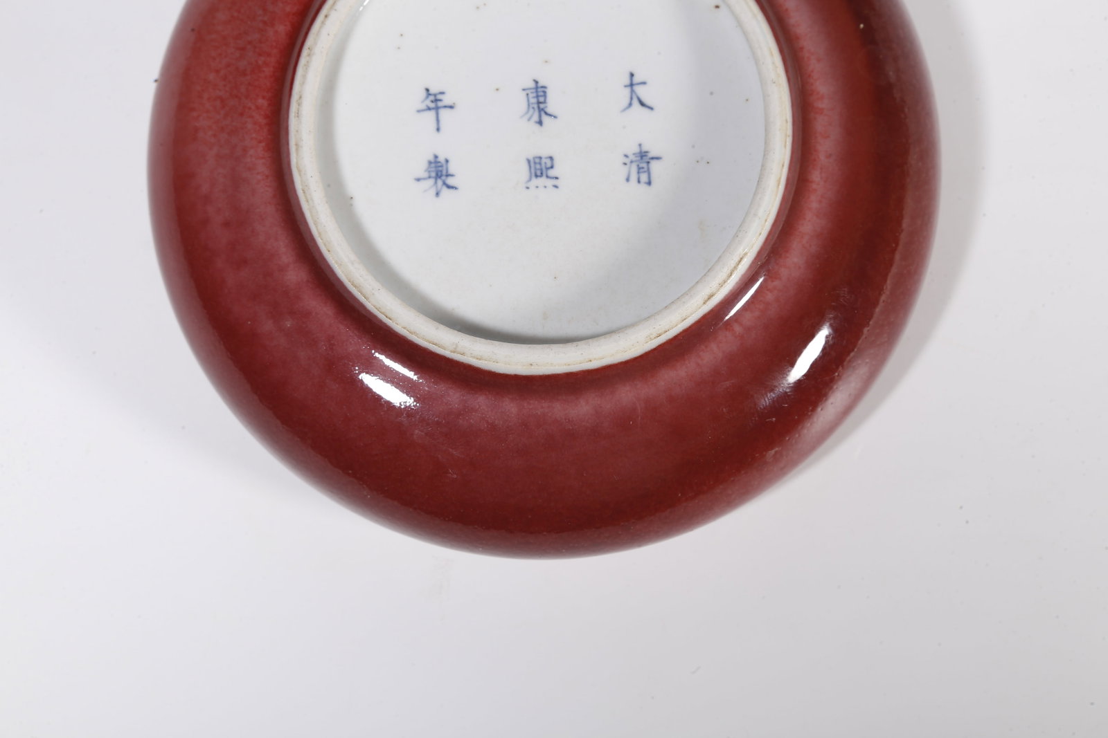 A RED GLAZE WASHER - 9