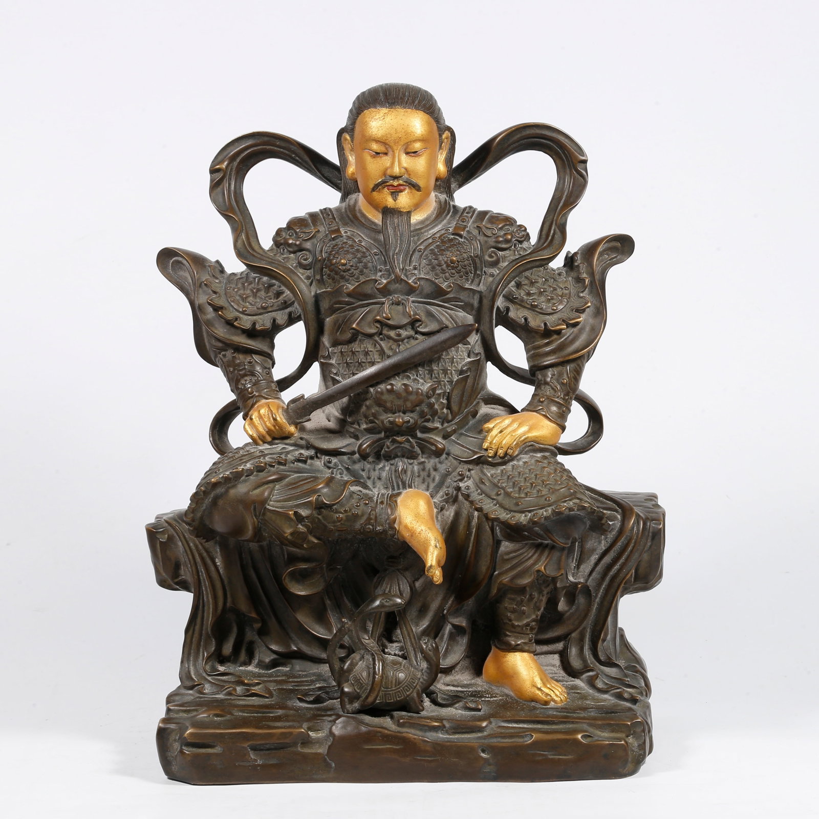 A GILT-BRONZE ZHENWU GREAT EMPEROR STATUE (PARTIALLY GILDED): Gilt-bronze Zhenwu Great Emperor statue (partially gilded)