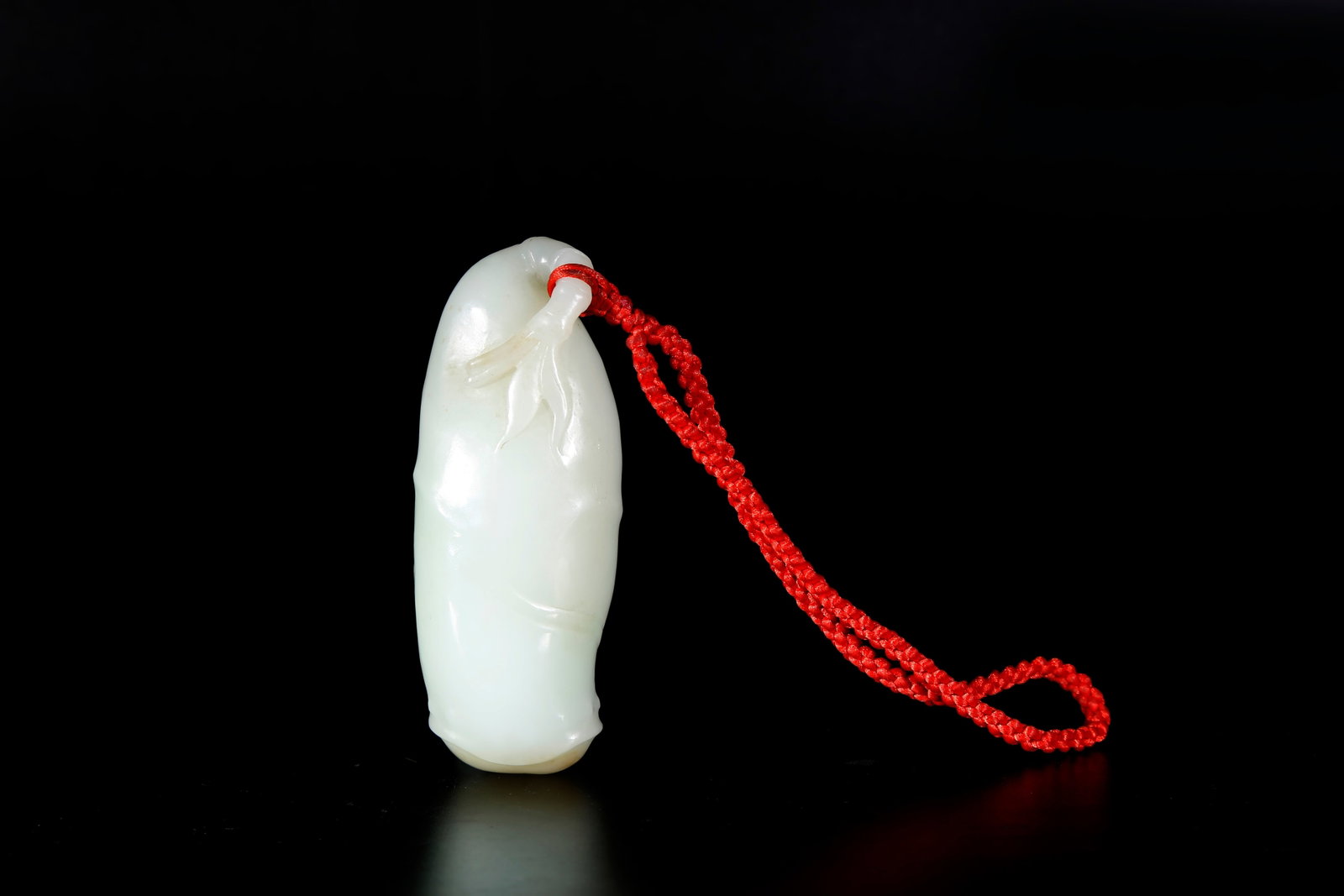A NEPHRITE BAMBOO-JOINT SHAPED HAND PIECE: Nephrite Bamboo-joint Shaped Hand Piece