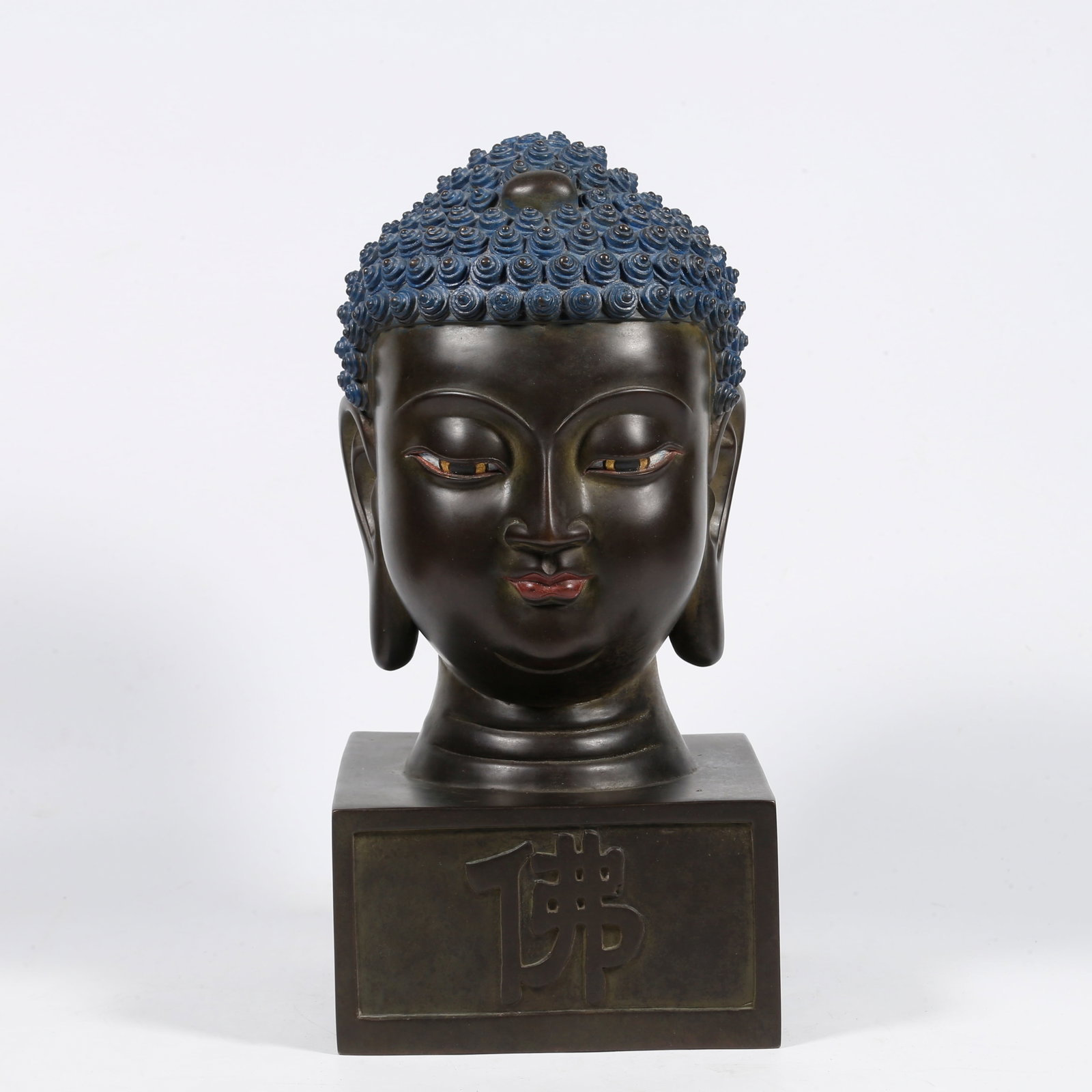 A BRONZE BUDDHA HEAD SEAL: Bronze Buddha head seal