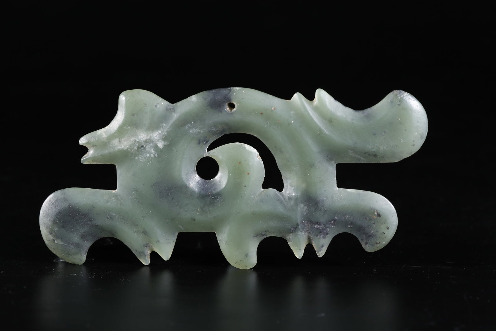 A ARCHAIC JADE CLOUD-PATTERN PENDANT (1 of 9)
