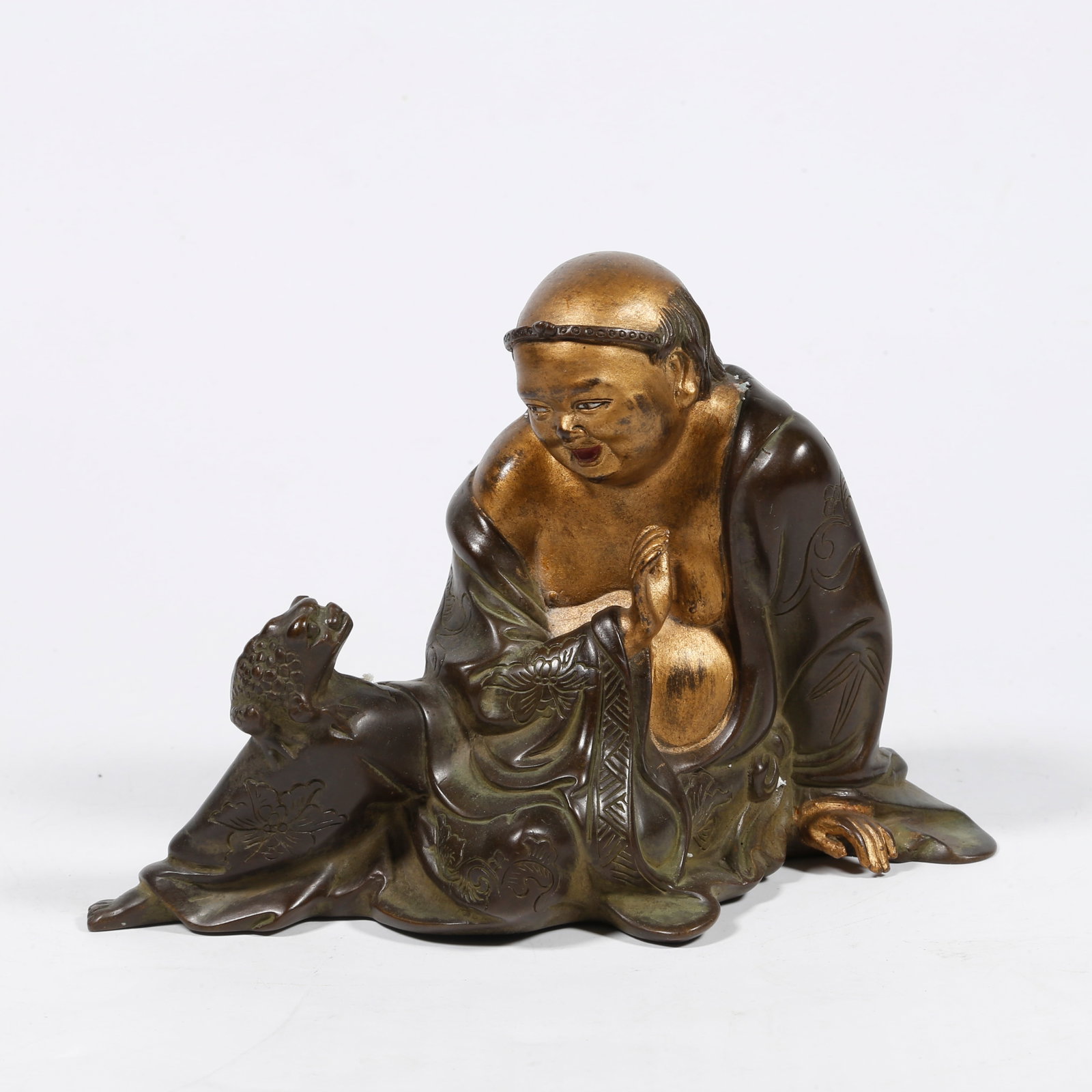 A GILT-BRONZE FIGURE ORNAMENT (1 of 9)