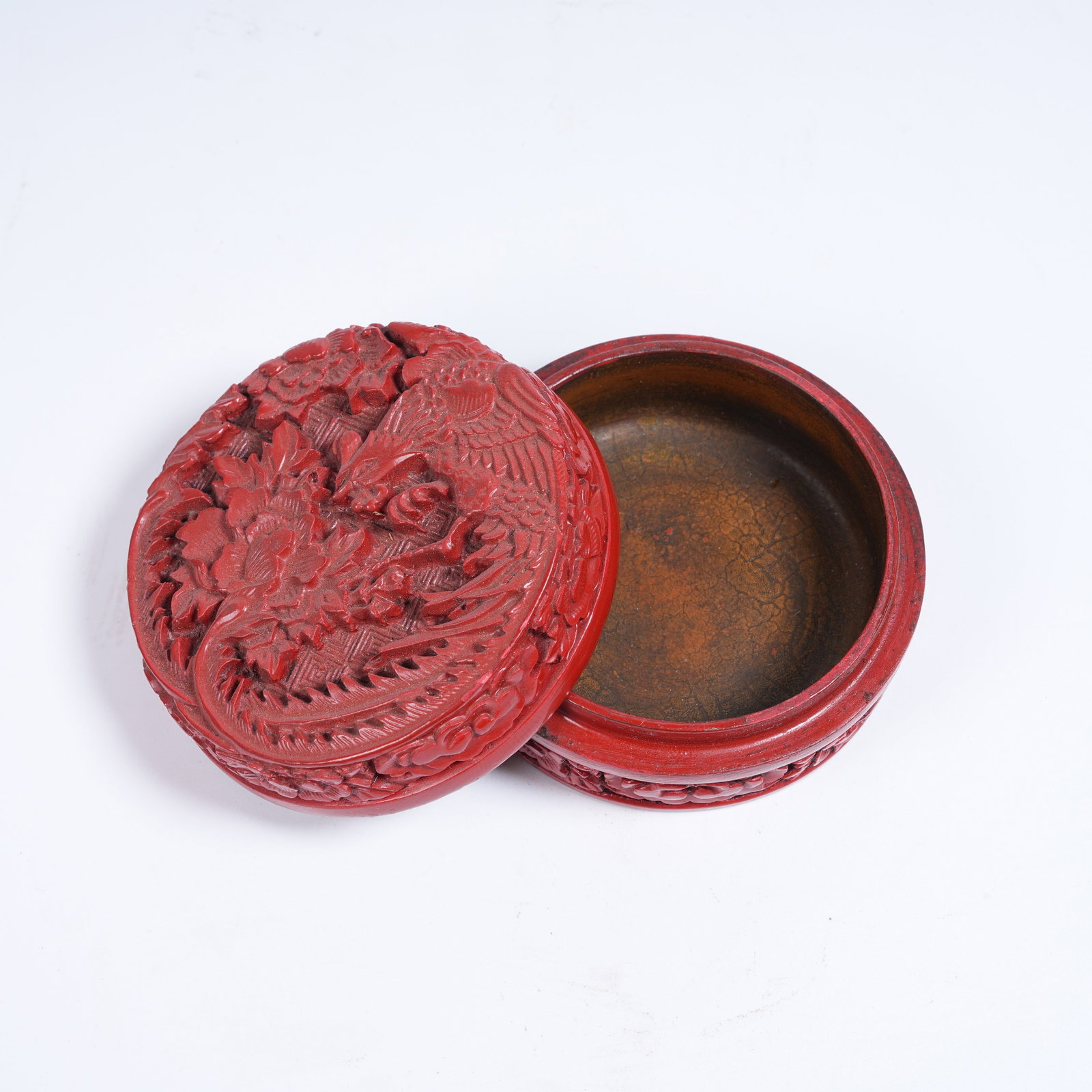 A RED CARVED LACQUER COVERED BOX WITH PHOENIX AND FLORAL PATTERN (1 of 11)
