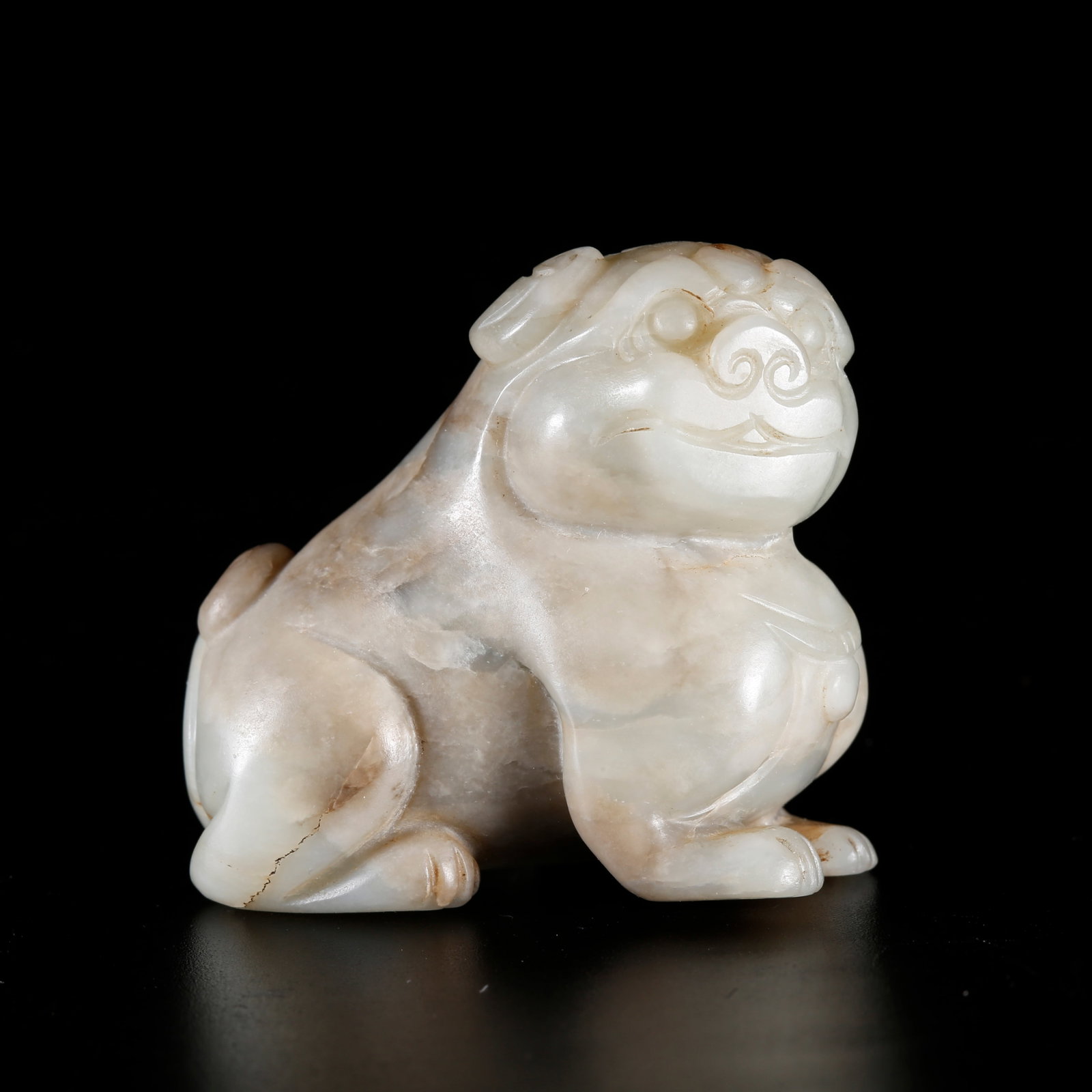A HETIAN JADE CARVED LION PENDANT (1 of 9)