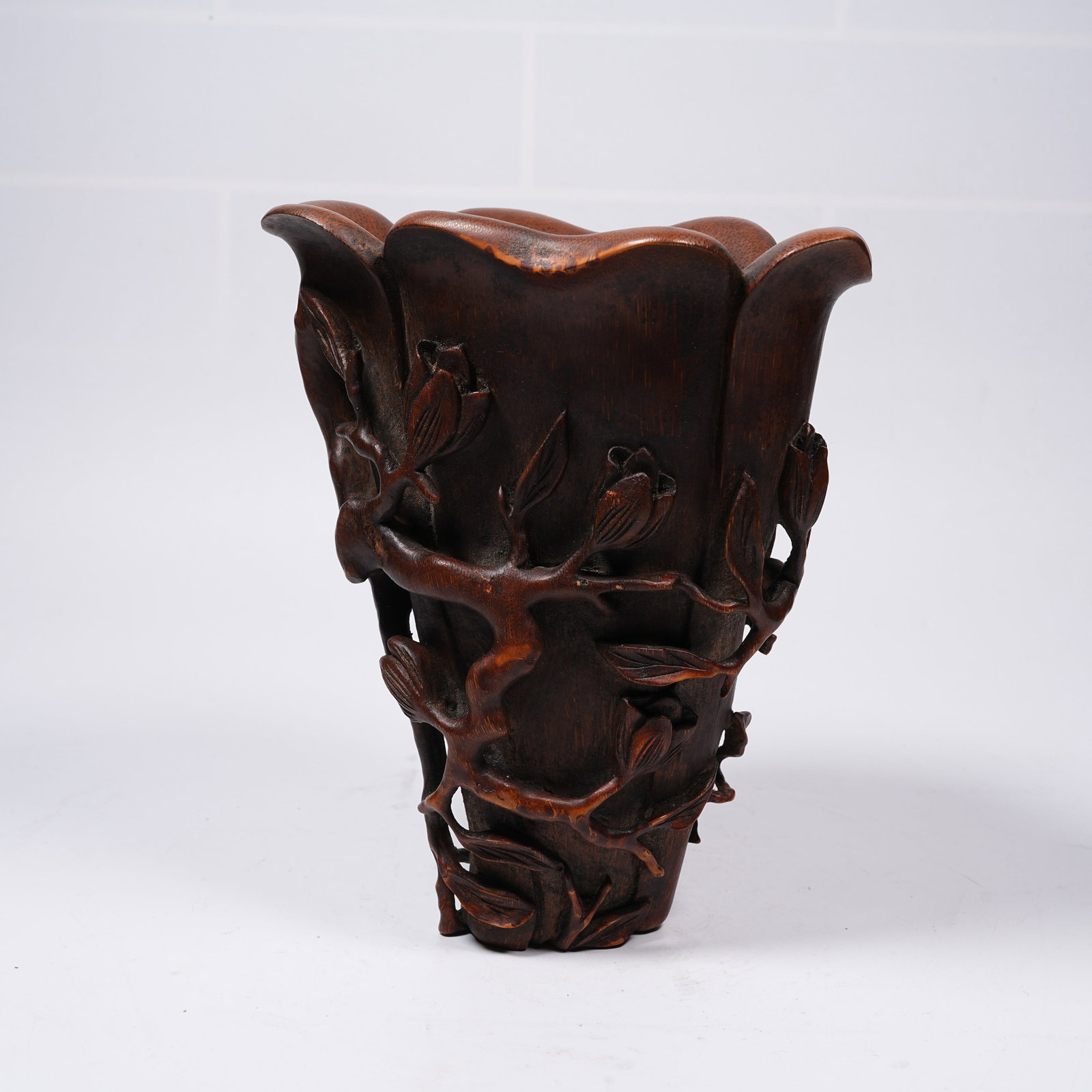 A HUANGHUALI WOOD FLORAL PATTERN CUP: Huanghuali Wood Floral Pattern Cup