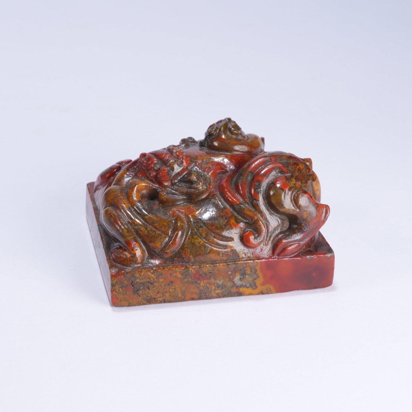 A WARRING STATES RED AGATE SEAL STONE WITH CHILONG PATTERN: Warring States Red Agate Seal Stone with Chilong Pattern