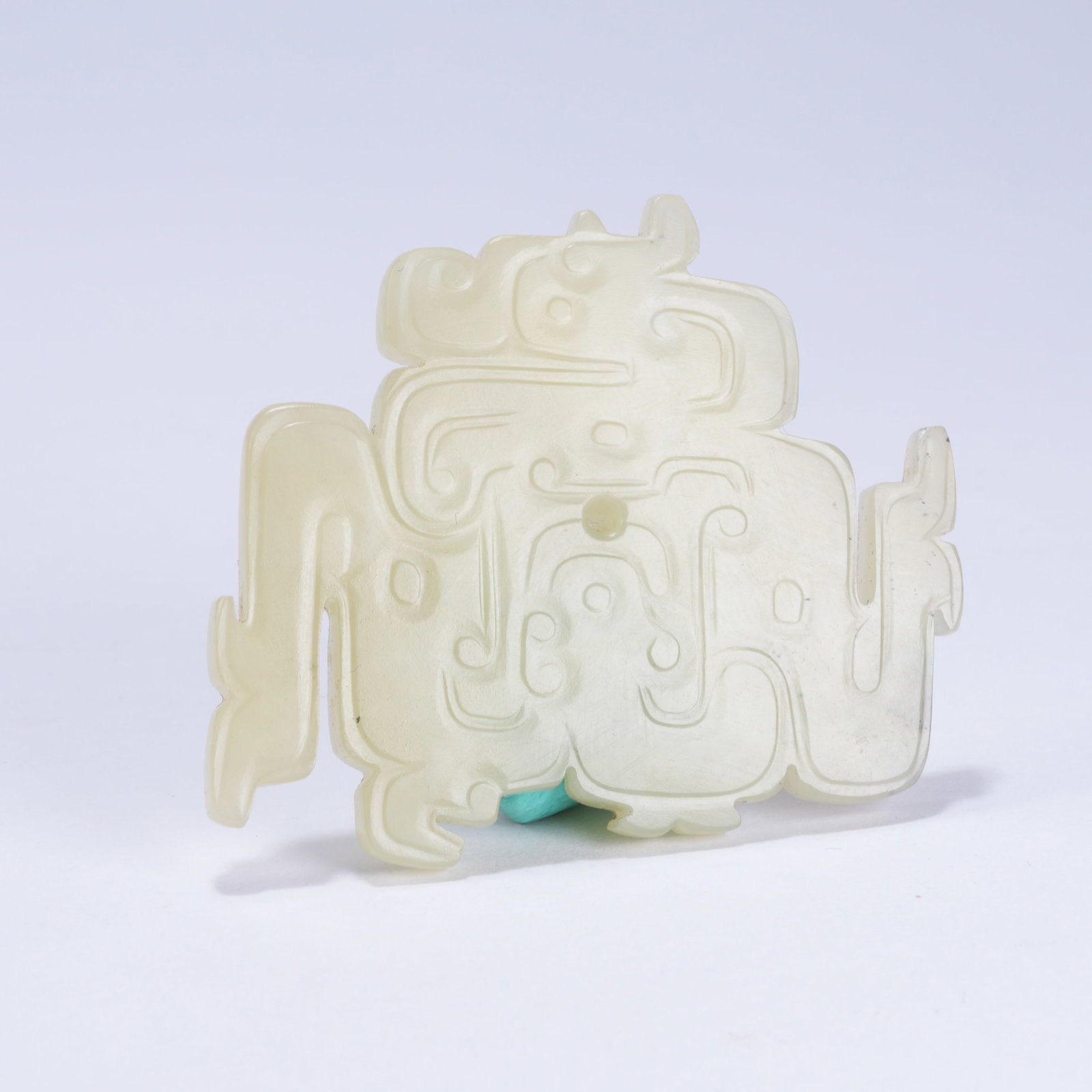 A HETIAN JADE CLOUD SCROLL PATTERN PENDANT: Hetian Jade Cloud Scroll Pattern Pendant