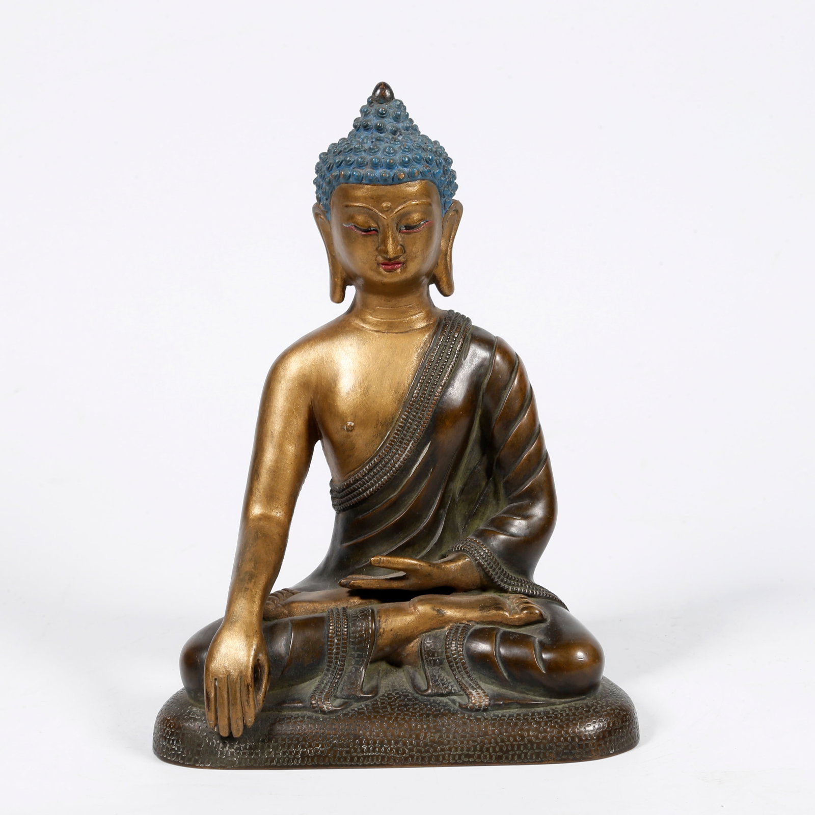 A GILT-BRONZE SHAKYAMUNI BUDDHA STATUE (PARTIALLY GILDED): Gilt-bronze Shakyamuni Buddha statue (partially gilded)