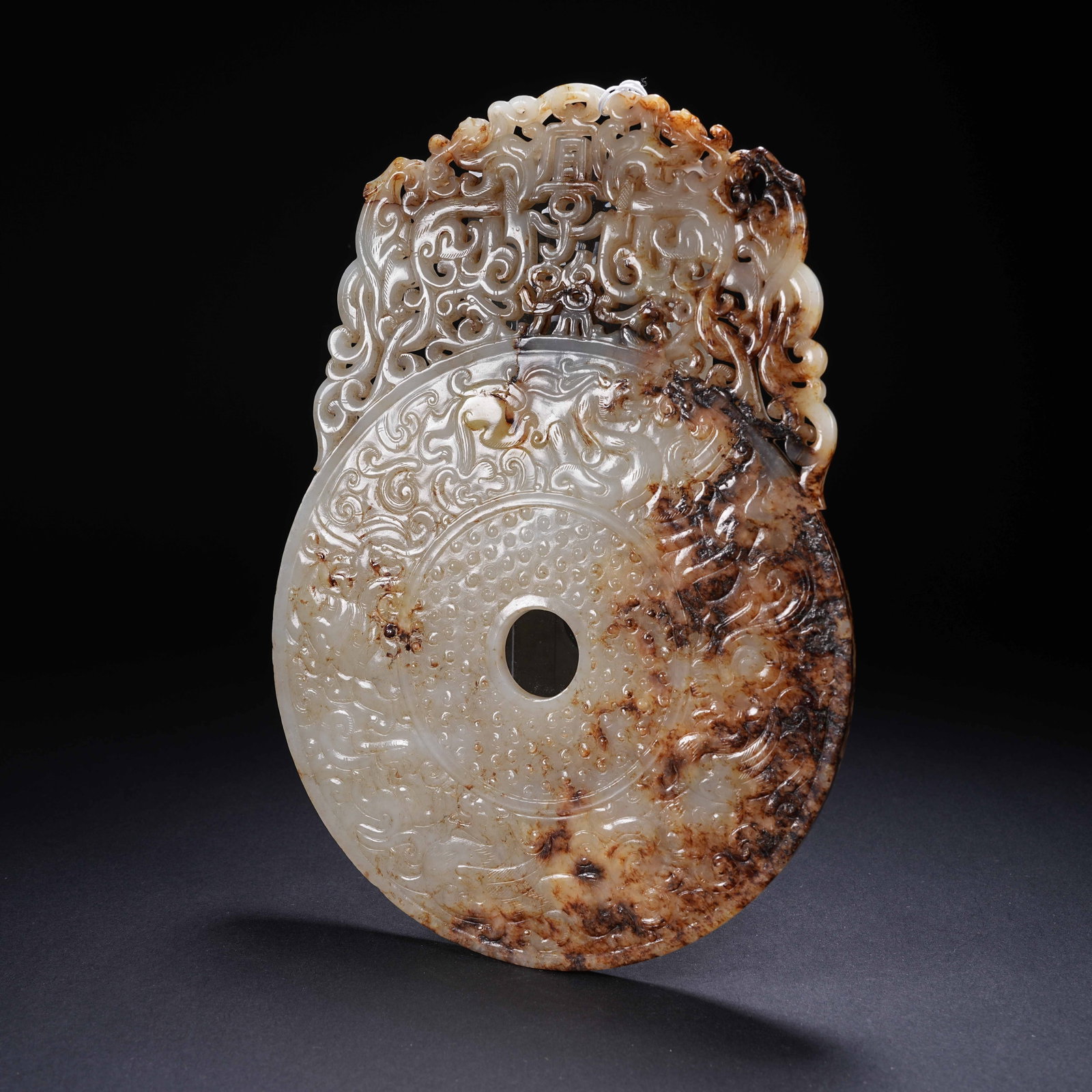 A ARCHAIC JADE BI DISC WITH "FOUR DEITIES" AND "MAY SONS AND GRANDSONS PROSPER" INSCRIPTION WITH: Archaic Jade Bi Disc with "Four Deities" and "May Sons and Grandsons Prosper" Inscription with Projecting Edges