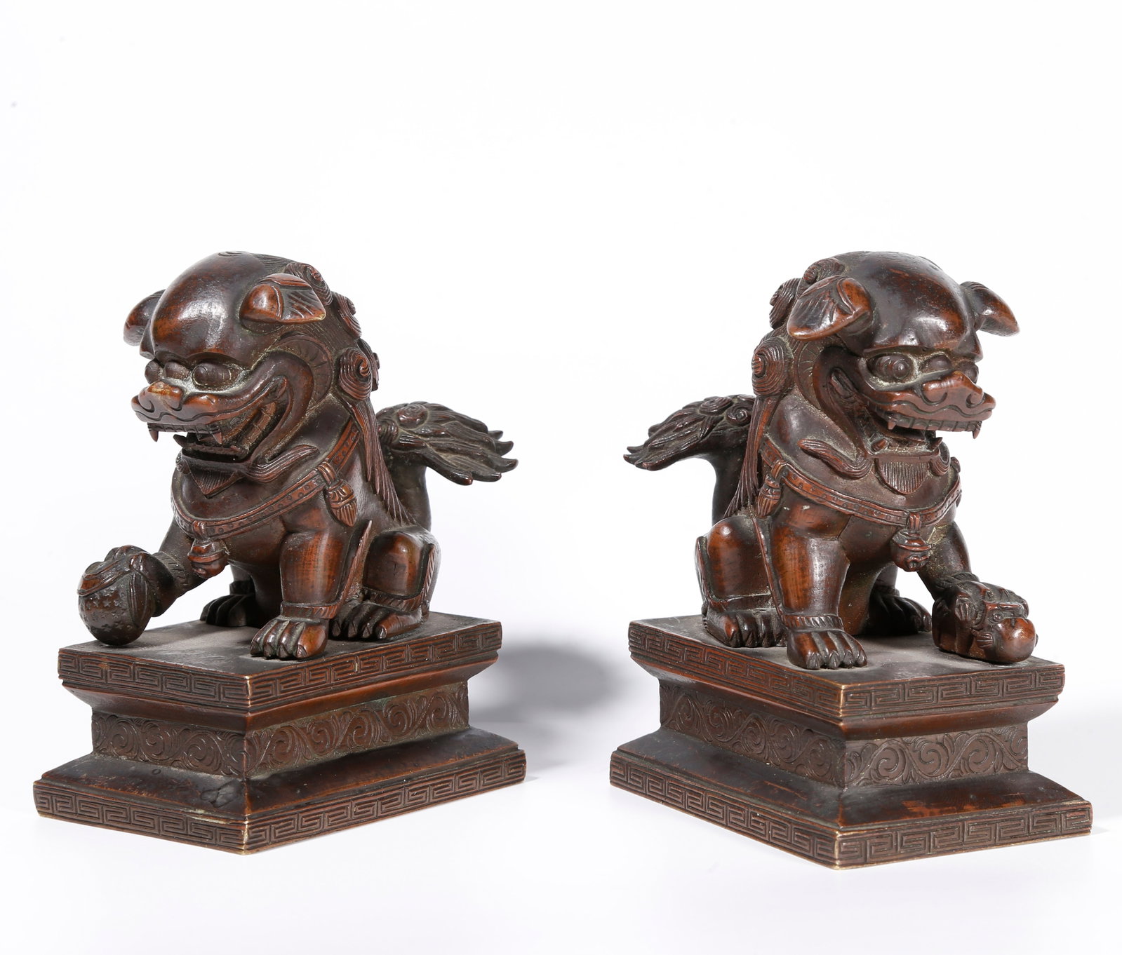 A PAIR OF BRONZE LION ORNAMENTS: Pair of Bronze Lion Ornaments