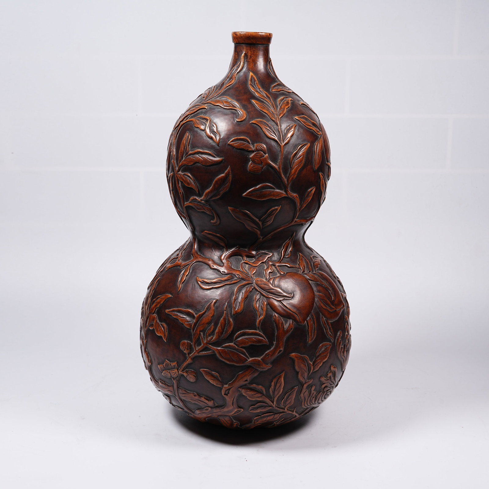 A HUANGHUALI WOOD GOURD VASE: Huanghuali Wood Gourd Vase