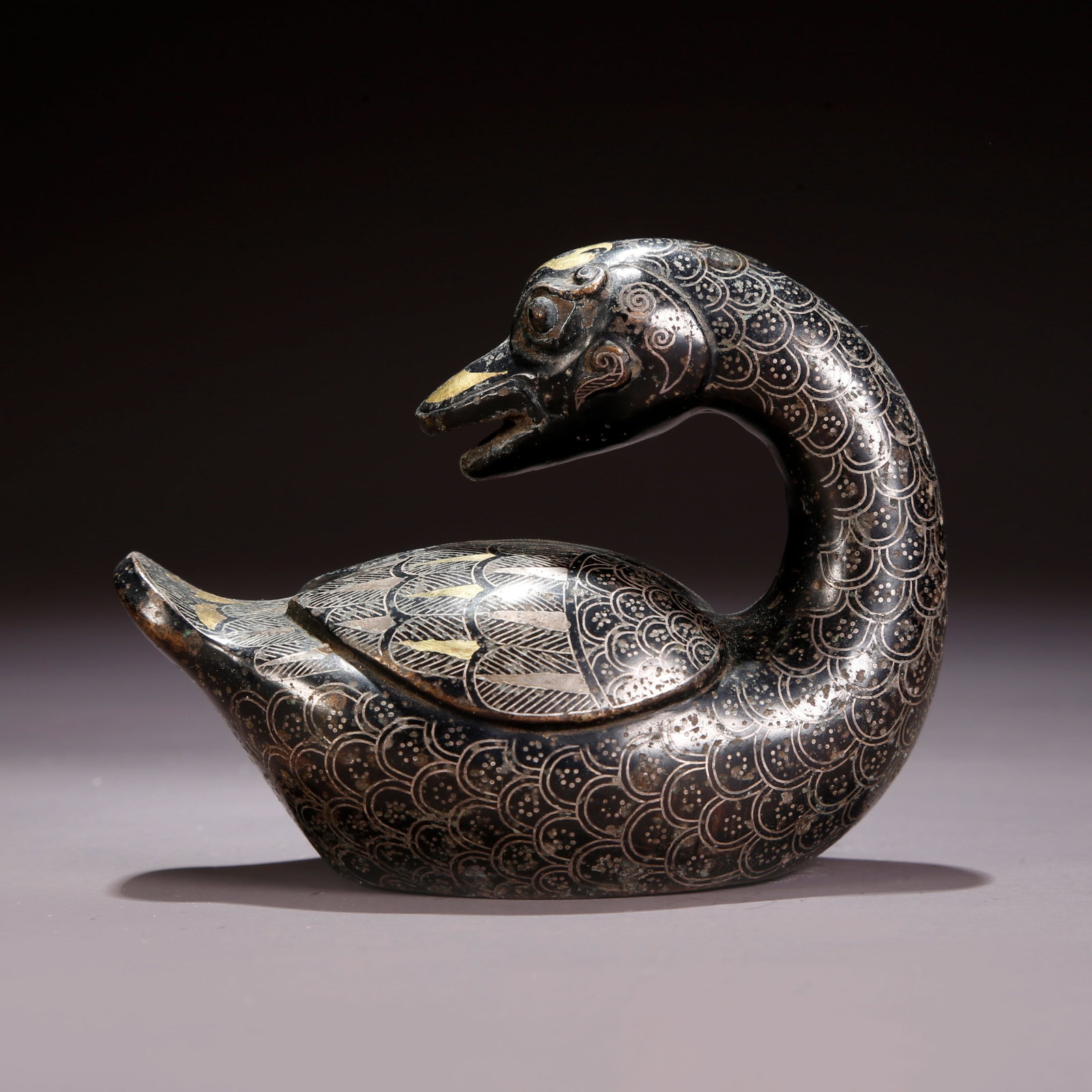 A GILT AND SILVER INLAID BRONZE GOOSE FIGURINE (1 of 9)