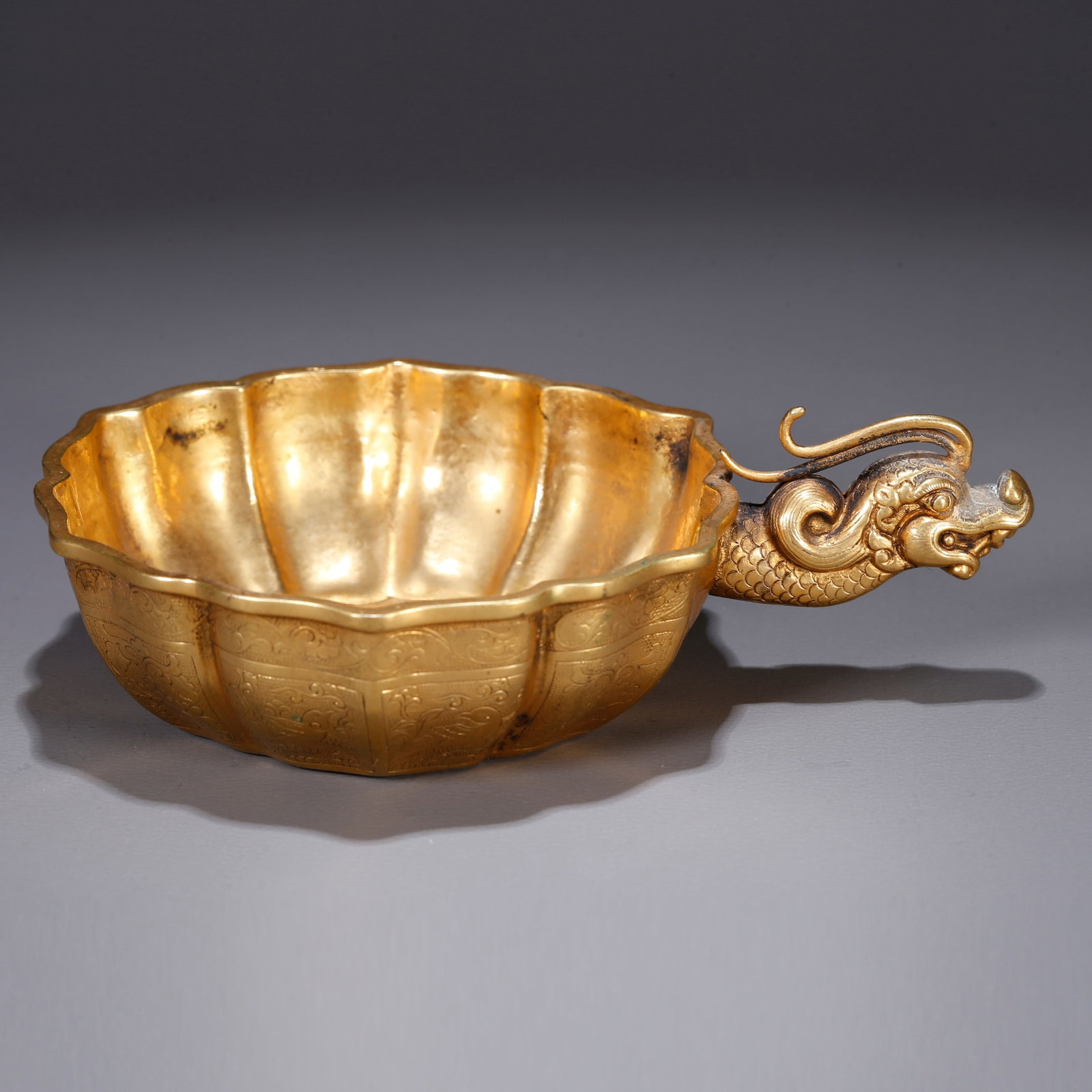 A GILT BRONZE CUP WITH FLORAL DESIGN (1 of 10)