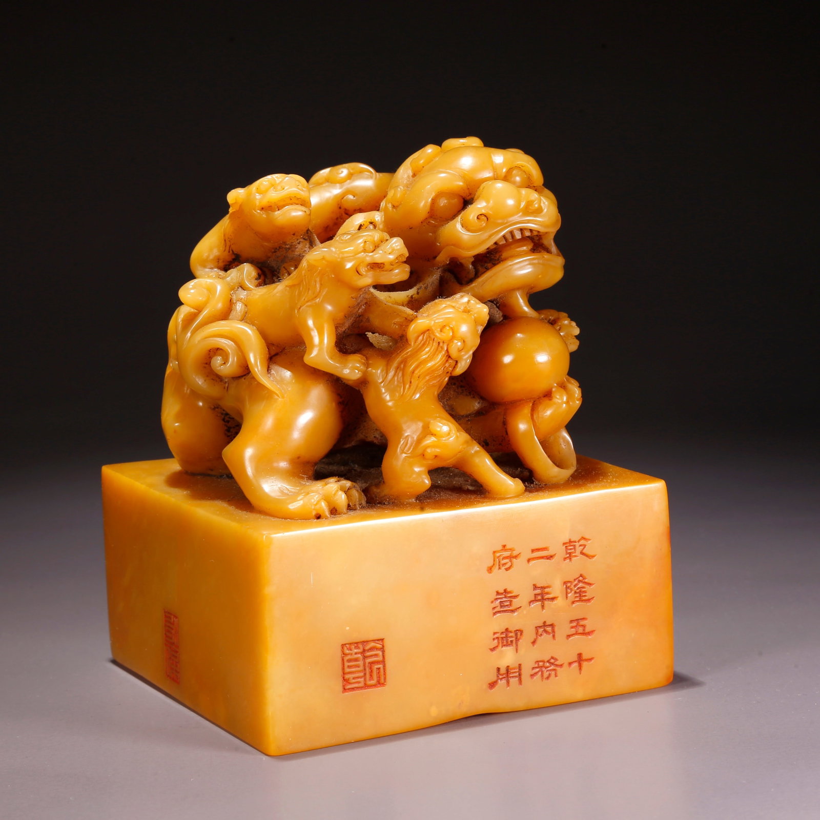 A SHOUSHAN TIANHUANG STONE SEAL WITH LION PLAYING WITH BALL KNOB: Shoushan Tianhuang Stone Seal with Lion Playing with Ball Knob