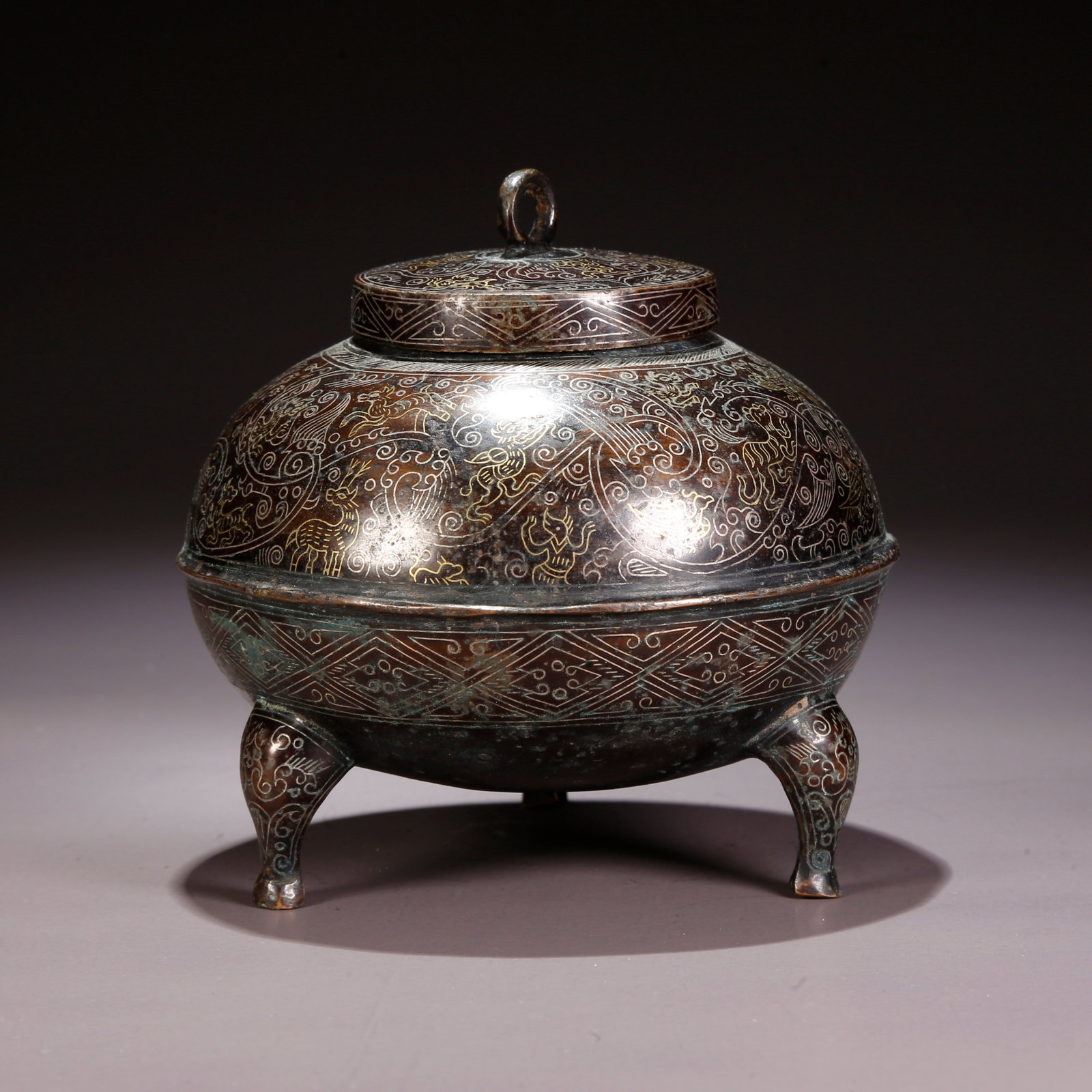 A GILT AND SILVER INLAID BRONZE COVERED INCENSE BURNER: Gilt and Silver Inlaid Bronze Covered Incense Burner